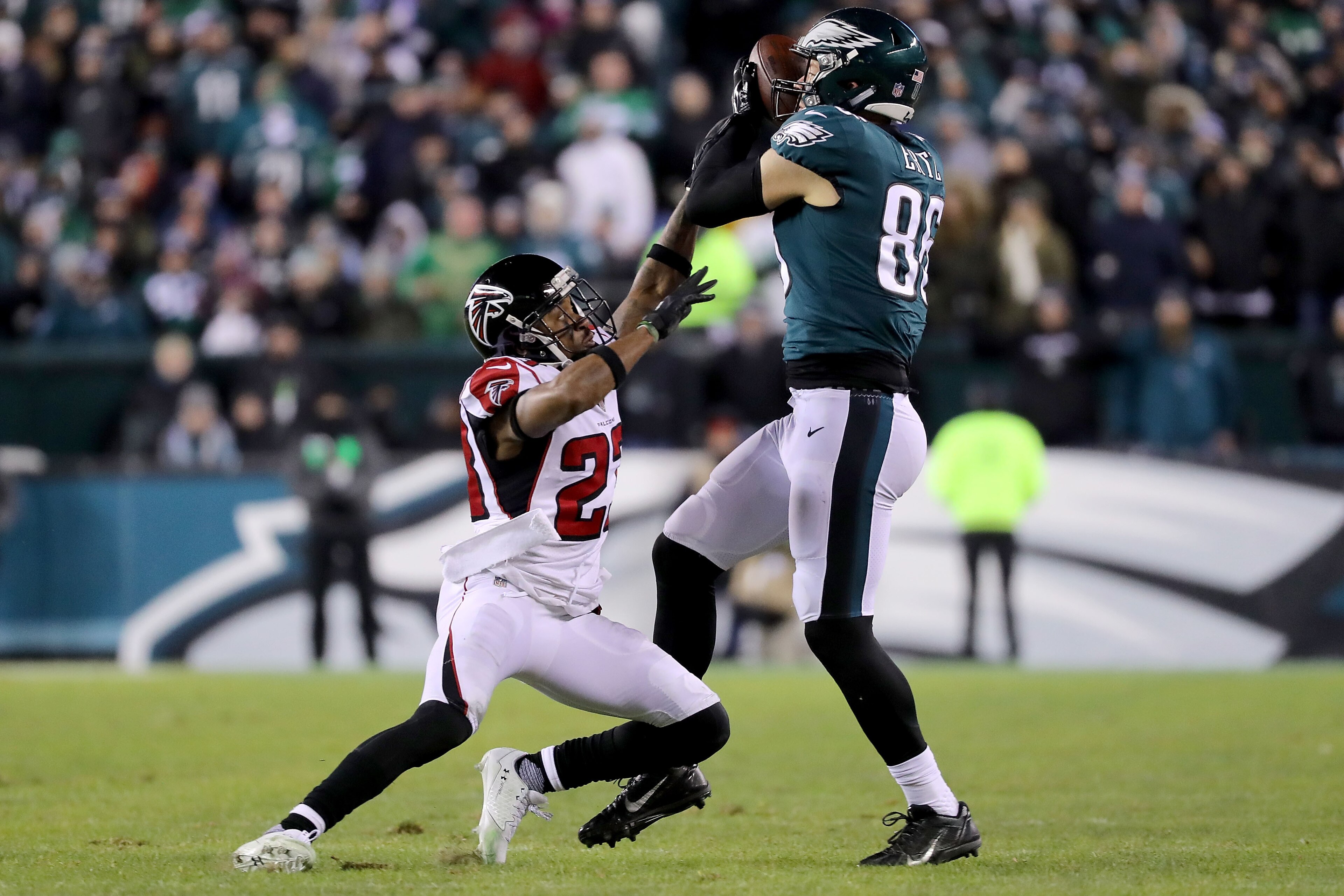 PHILADELPHIA, PA - JANUARY 13:  Robert Alford #23 of the Atlanta Falcons attempts to break up a pass to Zach Ertz #86 of the Philadelphia Eagles in the second half during the NFC Divisional Playoff game game at Lincoln Financial Field on January 13, 2018 