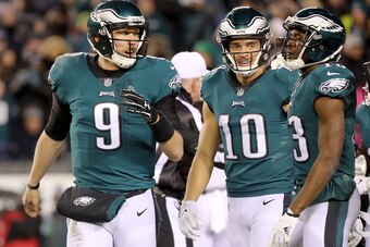 PHILADELPHIA, PA - JANUARY 13:  Nick Foles #9 of the Philadelphia Eagles speaks to Mack Hollins #10 and Marcus Johnson #14 of the Philadelphia Eagles in the second quarter against the Atlanta Falcons during the NFC Divisional Playoff game game at Lincoln 