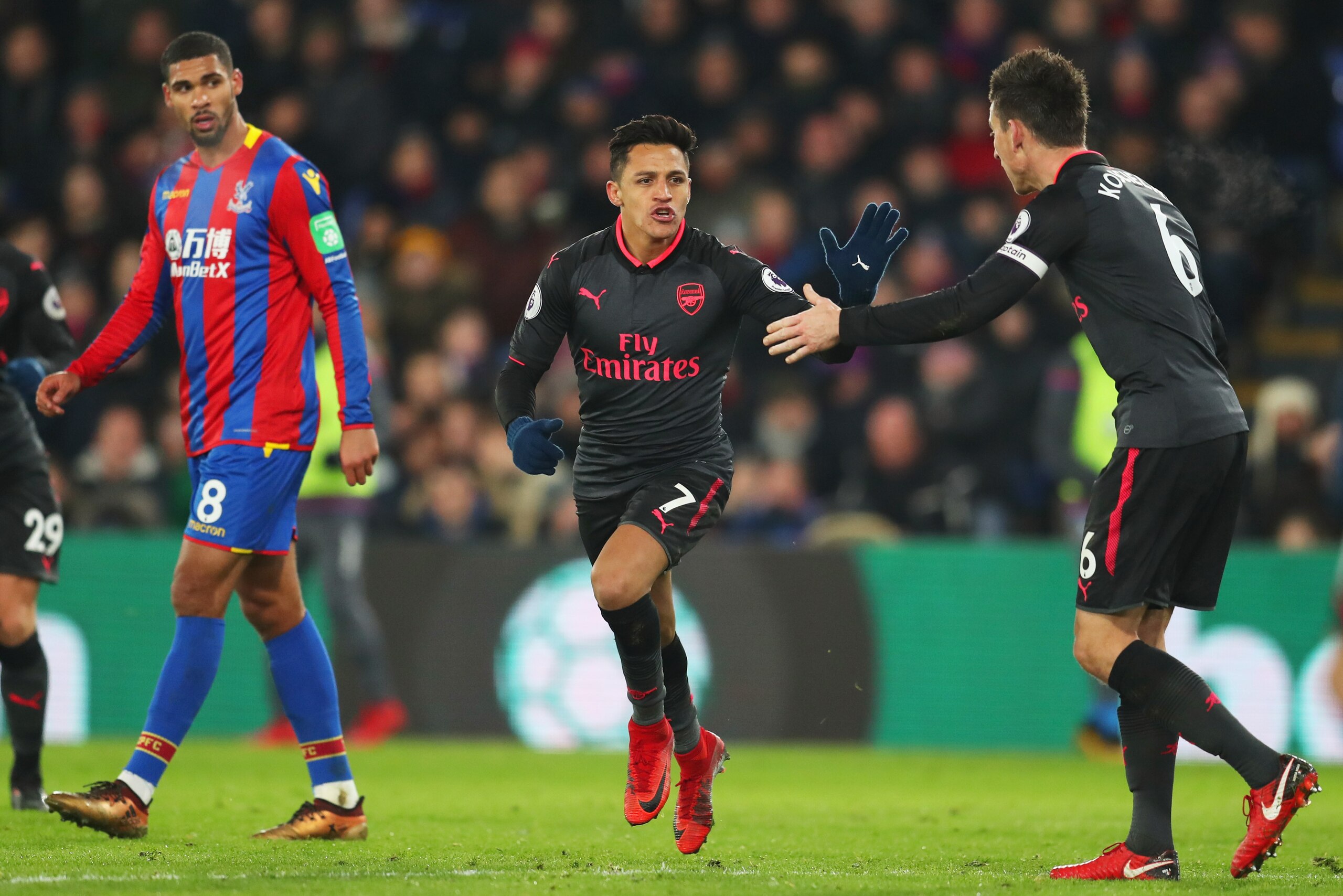 LONDON, ENGLAND - DECEMBER 28: Alexis Sanchez of Arsenal celebrates as he scores their second goal with Laurent Koscielny during the Premier League match between Crystal Palace and Arsenal at Selhurst Park on December 28, 2017 in London, England. (Photo LONDON, ENGLAND - DECEMBER 28: Alexis Sanchez of Arsenal celebrates as he scores their second goal with Laurent Koscielny during the Premier League match between Crystal Palace and Arsenal at Selhurst Park on December 28, 2017 in London, England. (Photo