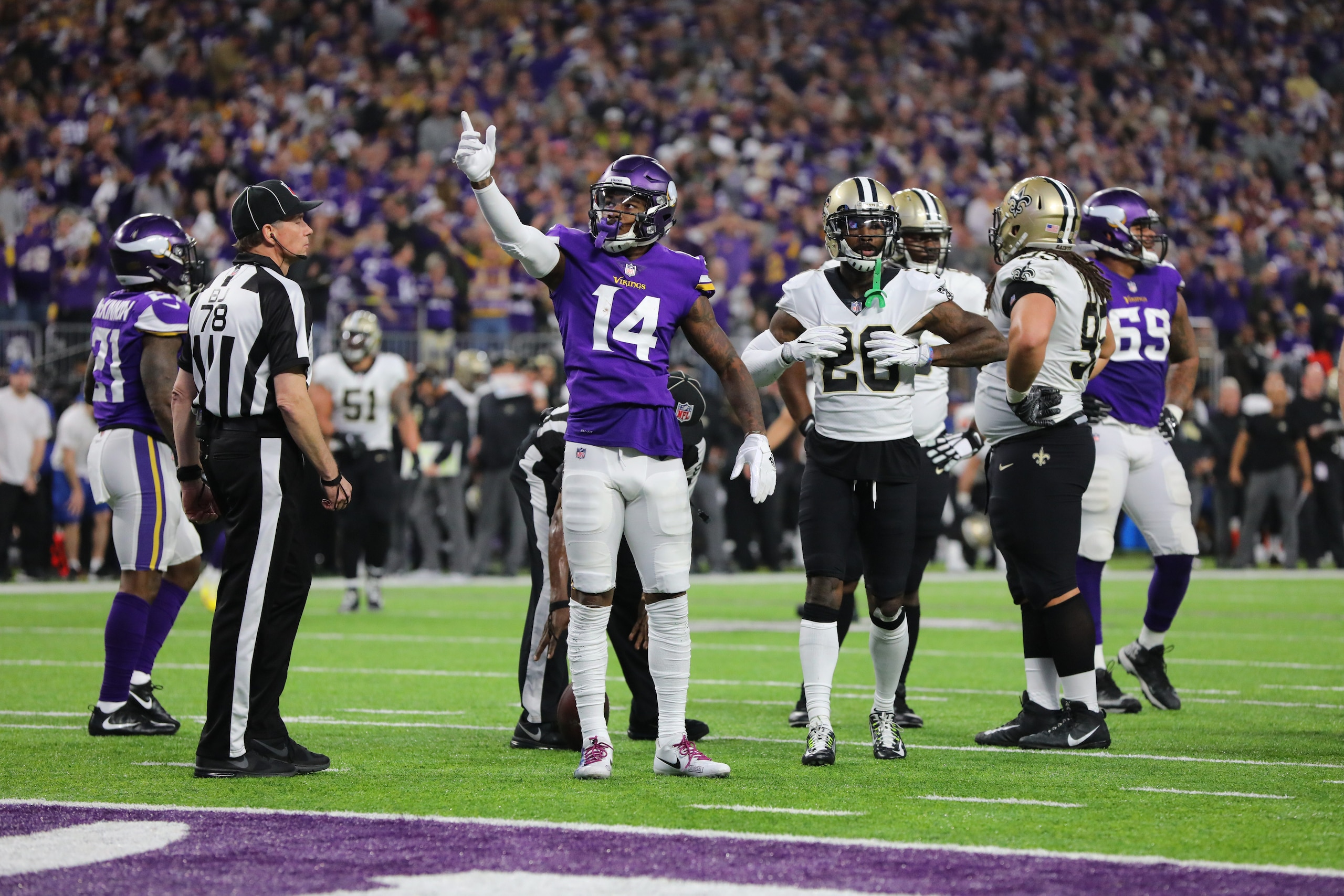 MINNEAPOLIS, MN - JANUARY 14:  Stefon Diggs #14 of the Minnesota Vikings celebrates a gain during the second quarter of the NFC Divisional Playoff game  against the New Orleans Saints on January 14, 2018 at U.S. Bank Stadium in Minneapolis, Minnesota. (Ph