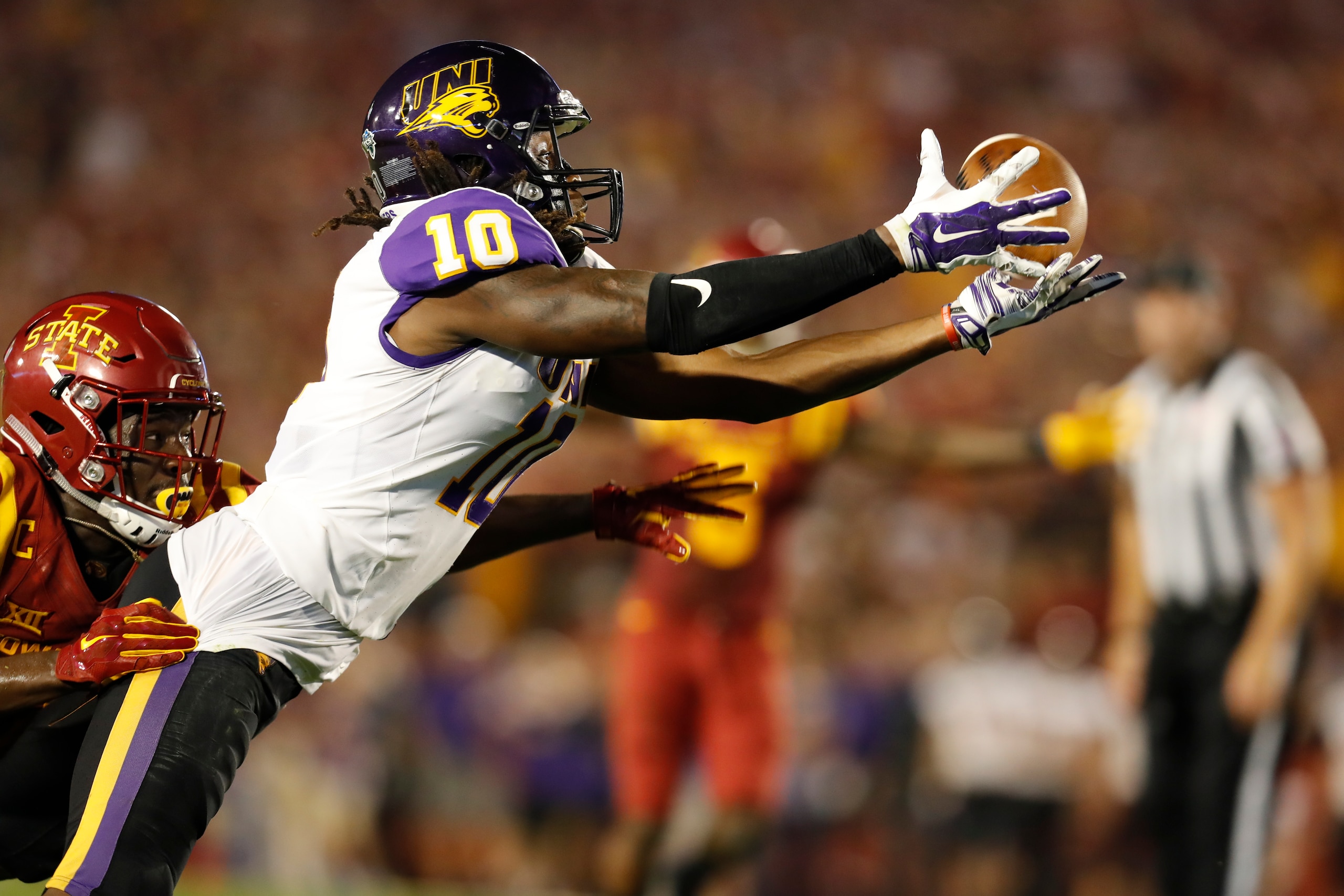 AMES, IA - SEPTEMBER 2: Wide receiver Daurice Fountain #10 of the Northern Iowa Panthers can't hold onto a touchdown pass as he is tackled by defensive back Brian Peavy #10 of the Iowa State Cyclones in the end zone in the first half of play at Jack Trice