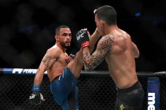BOSTON, MA - JANUARY 20:  Rob Font kicks against Thomas Almeida in their Bantamweight fight during UFC 220 at TD Garden on January 20, 2018 in Boston, Massachusetts.  (Photo by Mike Lawrie/Getty Images)