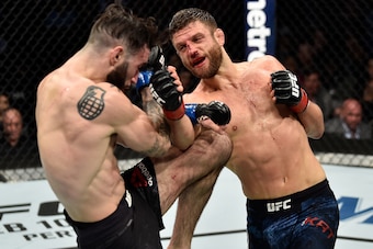 BOSTON, MA - JANUARY 20:  (R-L) Calvin Kattar punches Shane Burgos in their featherweight bout during the UFC 220 event at TD Garden on January 20, 2018 in Boston, Massachusetts. (Photo by Jeff Bottari/Zuffa LLC/Zuffa LLC via Getty Images)