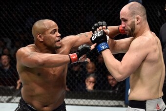 BOSTON, MA - JANUARY 20:  (L-R) Daniel Cormier punches Volkan Oezdemir of Switzerland in their light heavyweight championship bout during the UFC 220 event at TD Garden on January 20, 2018 in Boston, Massachusetts. (Photo by Jeff Bottari/Zuffa LLC/Zuffa L