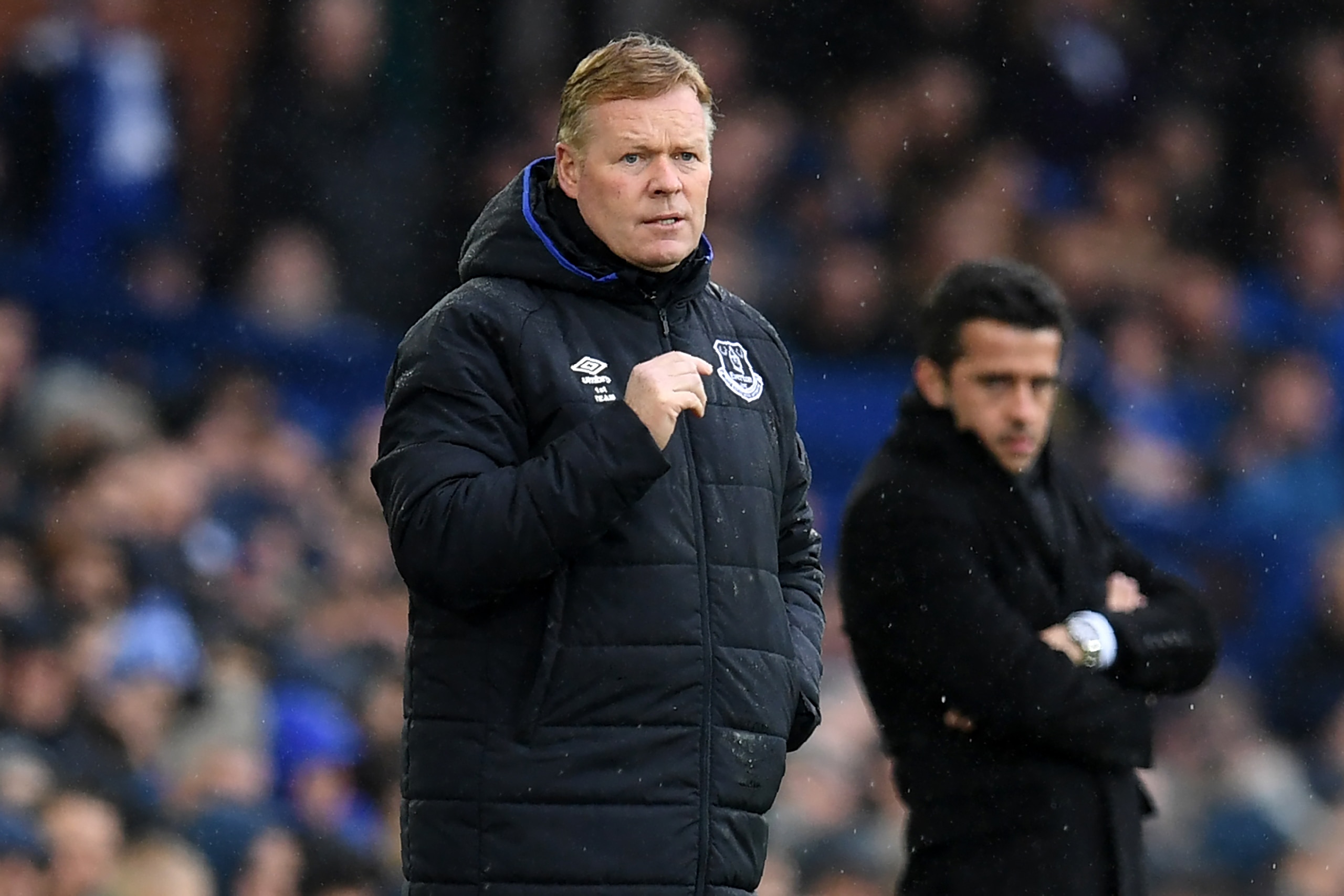 Everton's Dutch manager Ronald Koeman (L) and Hull City's Portuguese head coach Marco Silva watch from the touchline during the English Premier League football match between Everton and Hull City at Goodison Park in Liverpool, north west England on March 