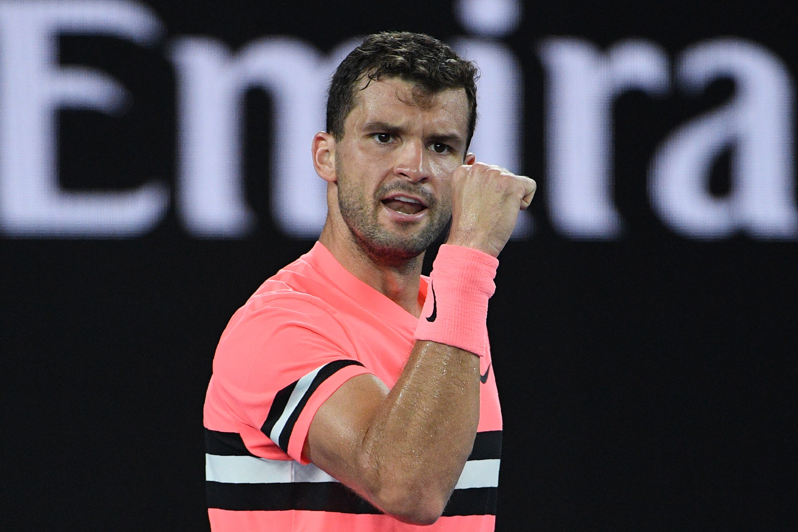 Bulgaria's Grigor Dimitrov reacts against Australia's Nick Kyrgios during their men's singles fourth round match on day seven of the Australian Open tennis tournament in Melbourne on January 21, 2018. / AFP PHOTO / SAEED KHAN / -- IMAGE RESTRICTED TO EDIT