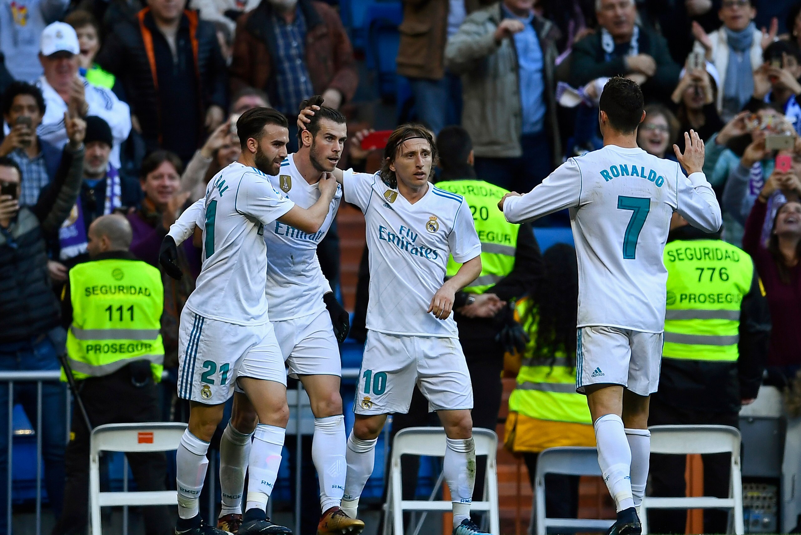 Real Madrid's Welsh forward Gareth Bale (2L) celebrates with Real Madrid's Spanish forward Borja Mayoral (L), Real Madrid's Croatian midfielder Luka Modric (2R) and Real Madrid's Portuguese forward Cristiano Ronaldo after scoring during the Spanish league