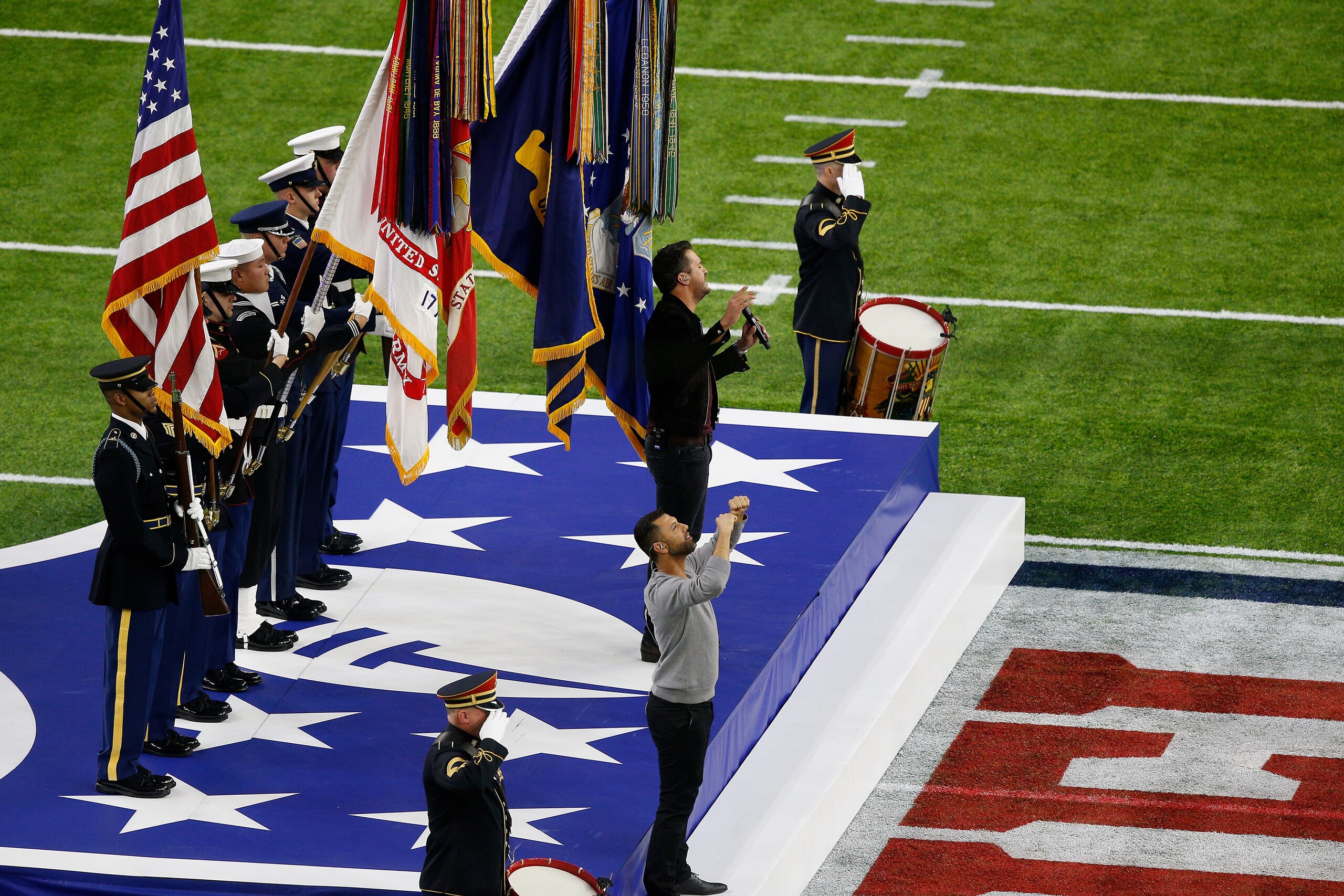 HOUSTON, TX - FEBRUARY 05: Singer-songwriter Luke Bryan sings the National Anthem prior to Super Bowl 51 between the Atlanta Falcons and the New England Patriots at NRG Stadium on February 5, 2017 in Houston, Texas.  (Photo by Bob Levey/Getty Images)