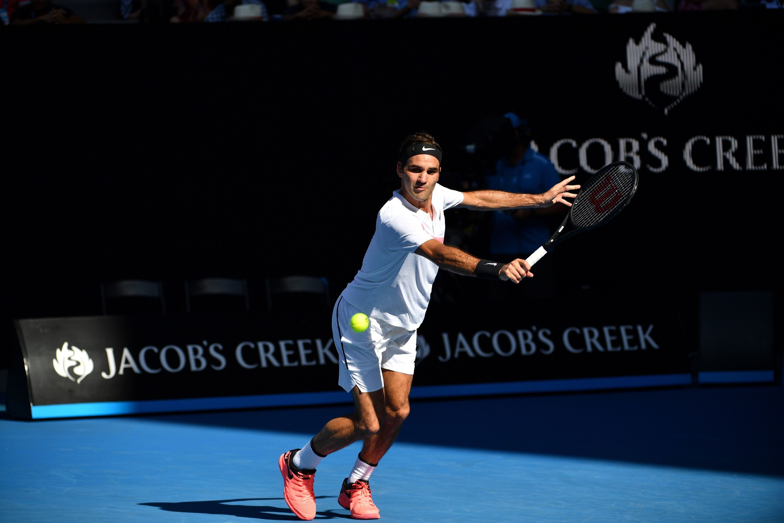 Switzerland's Roger Federer hits a return against Marton Fucsovics of Hungary during their men's singles fourth round match on day eight of the Australian Open tennis tournament in Melbourne on January 22, 2018.
  / AFP PHOTO / SAEED KHAN / -- IMAGE RESTR