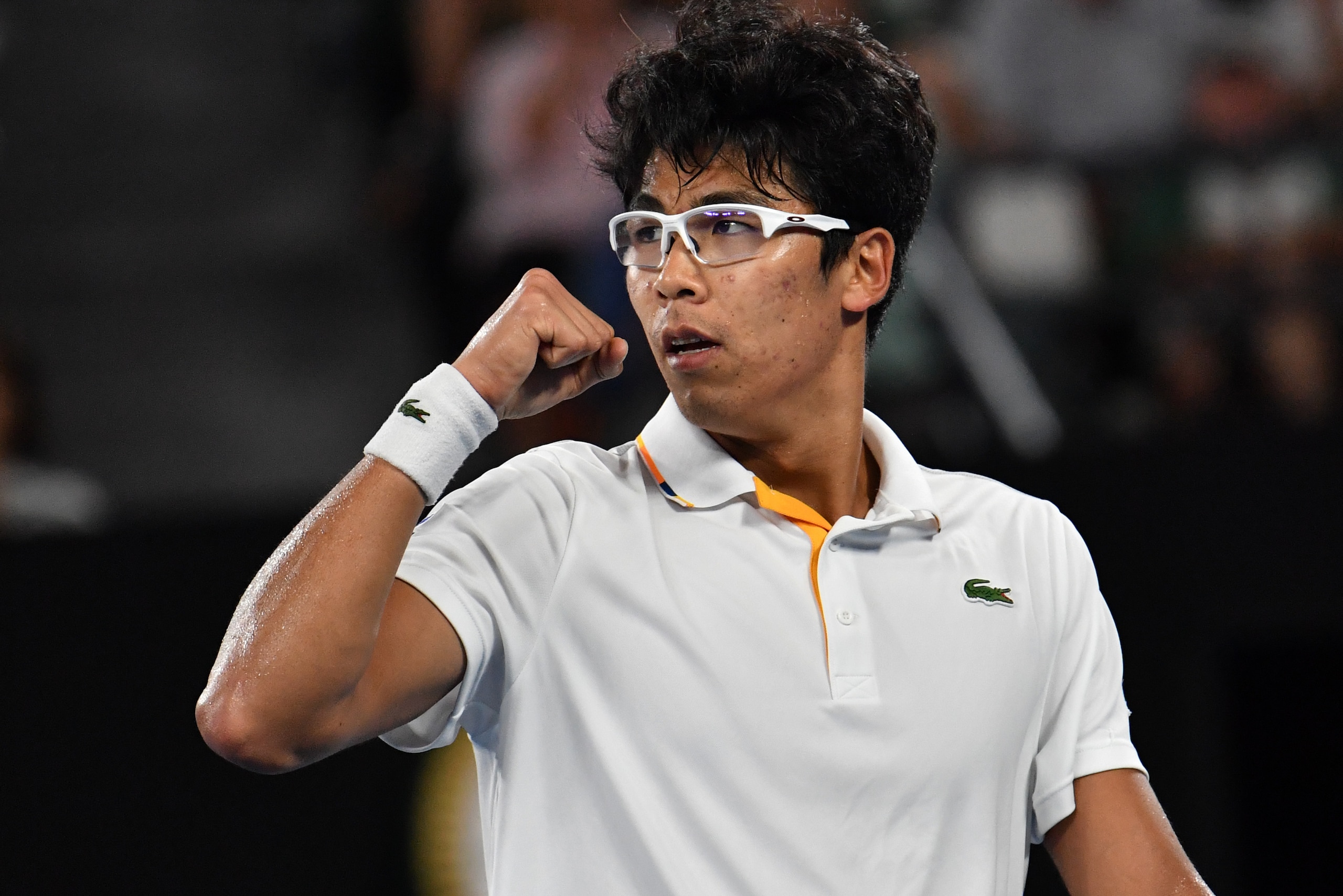 South Korea's Hyeon Chung reacts during their men's singles fourth round match against Serbia's Novak Djokovic on day eight of the Australian Open tennis tournament in Melbourne on January 22, 2018. / AFP PHOTO / SAEED KHAN / -- IMAGE RESTRICTED TO EDITOR