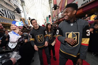 LAS VEGAS, NV - JANUARY 14:  Goaltenders Marc-Andre Fleury #29 and Malcolm Subban #30 of the Vegas Golden Knights laugh as they sign autographs for fans on a red carpet during the Vegas Golden Knights Fan Fest at the Fremont Street Experience on January 1