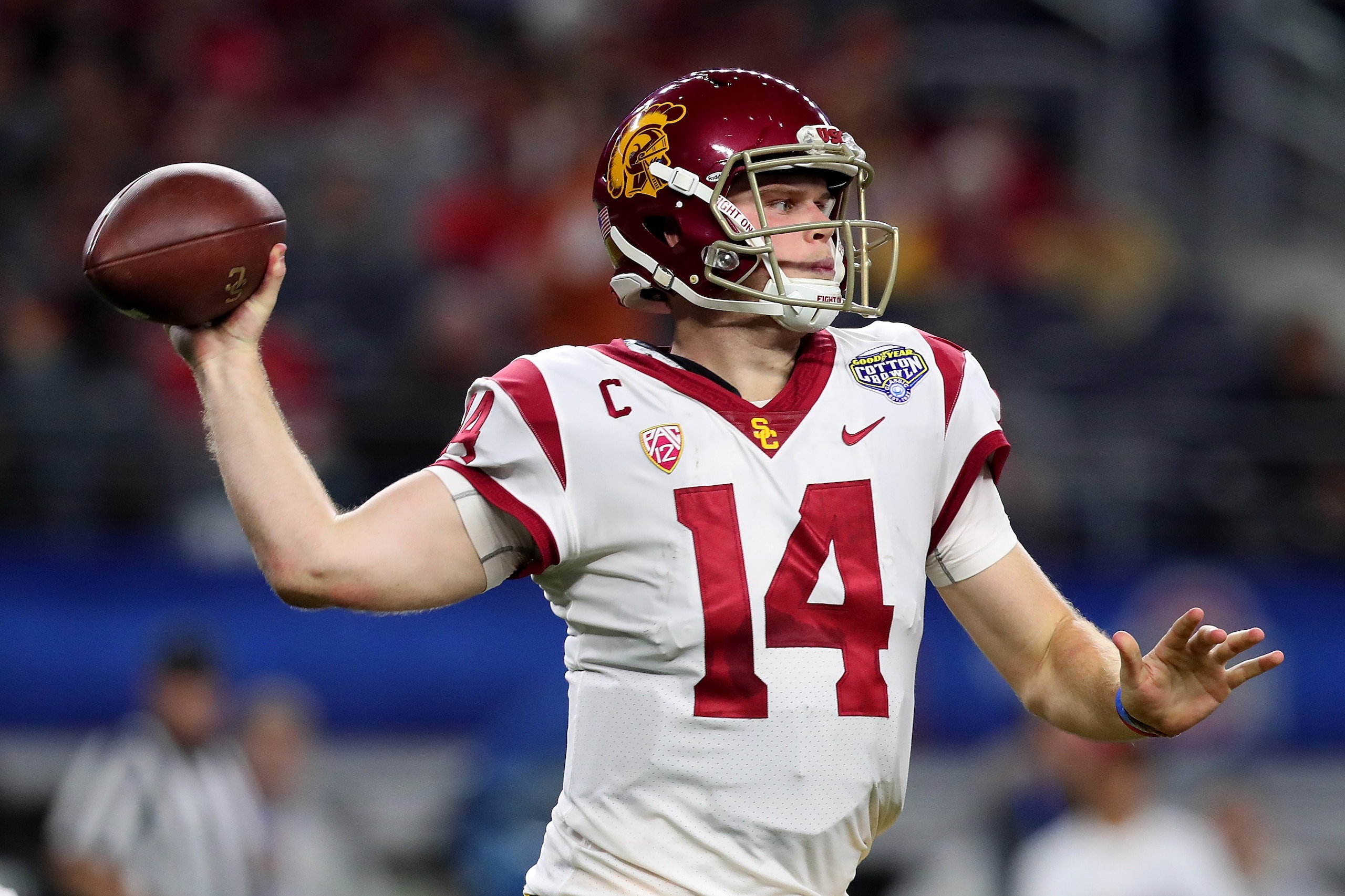 ARLINGTON, TX - DECEMBER 29:  Sam Darnold #14 of the USC Trojans looks for an open receiver against the Ohio State Buckeyes during the Goodyear Cotton Bowl Classic at AT&T Stadium on December 29, 2017 in Arlington, Texas.  (Photo by Tom Pennington/Getty I