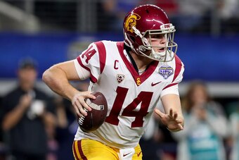 ARLINGTON, TX - DECEMBER 29:  Sam Darnold #14 of the USC Trojans looks for an open receiver against the Ohio State Buckeyes during the Goodyear Cotton Bowl Classic at AT&T Stadium on December 29, 2017 in Arlington, Texas.  (Photo by Tom Pennington/Getty I