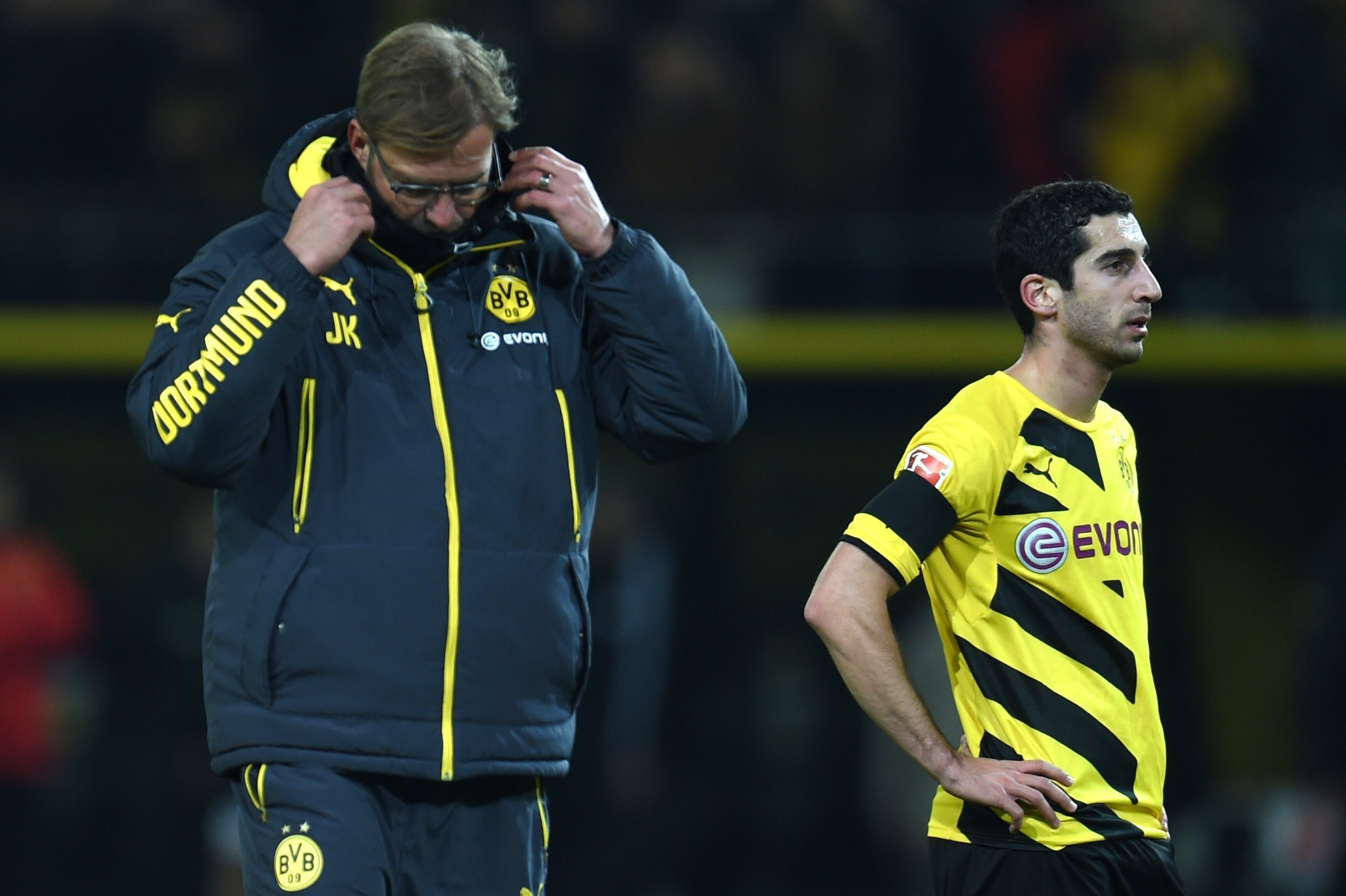 Dortmund's head coach Juergen Klopp (L) and  Dortmund's Armenian midfielder Henrikh Mkhitaryan react after the German first division Bundesliga football match Borussia Dortmund vs FC Augsburg in the Signal Iduna Park stadium in Dortmund, western Germany o