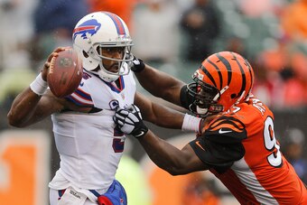 CINCINNATI, OH - OCTOBER 08:  Tyrod Taylor #5 of the Buffalo Bills attempts to break a tackle from Geno Atkins #97 of the Cincinnati Bengals at Paul Brown Stadium on October 8, 2017 in Cincinnati, Ohio.  (Photo by Michael Reaves/Getty Images)
