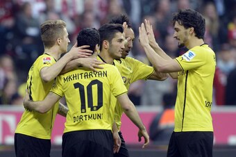(L-R) Dortmund's midfielder Marco Reus, Dortmund's Armenian midfielder Henrikh Mkhitaryan, Dortmund's Turkish midfielder Nuri Sahin, and Dortmund's defender Mats Hummels celebrate after the second goal for Dortmund during the German first division Bundesl