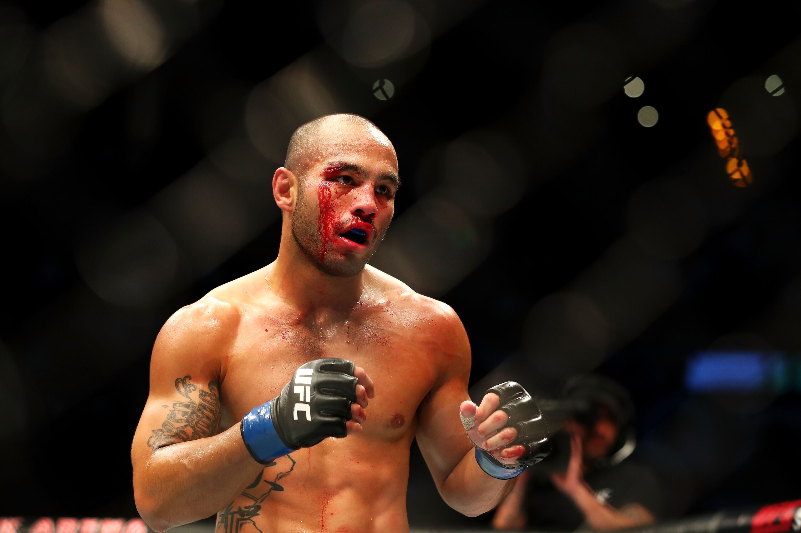 SYDNEY, AUSTRALIA - NOVEMBER 19: Frank Camacho of Guam bleeds as he shapes up against Damien Brown of Australia in their lightweight bout during the UFC Fight Night at Qudos Bank Arena on November 19, 2017 in Sydney, Australia.  (Photo by Mark Kolbe/Getty