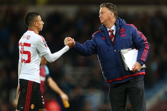 LONDON, ENGLAND - APRIL 13: Louis van Gaal Manager of Manchester United and Jesse Lingard of Manchester United after the Emirates FA Cup Sixth Round Replay match between West Ham United and Manchester United at Boleyn Ground on April 13, 2016 in London, E