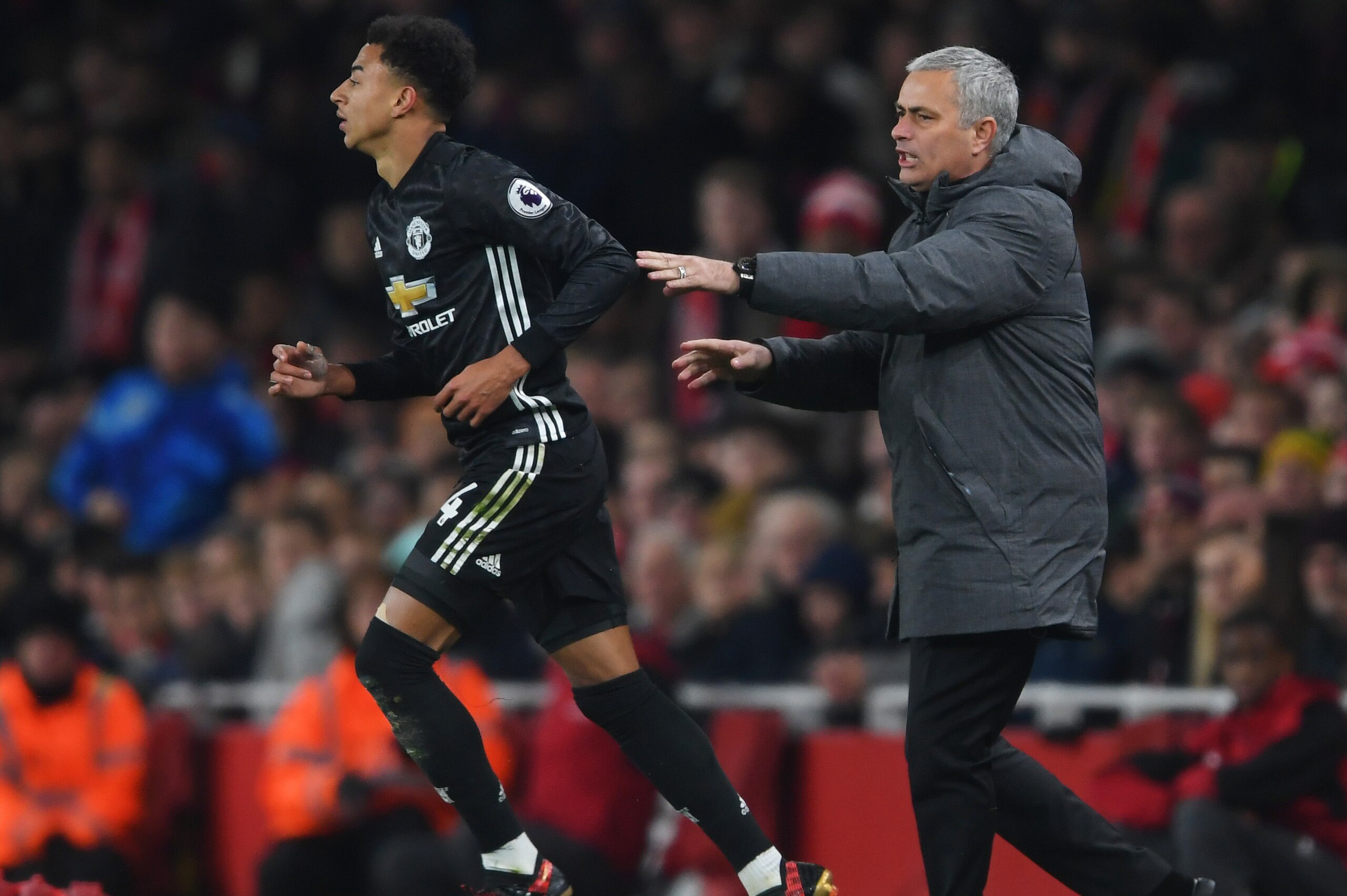 LONDON, ENGLAND - DECEMBER 02: Jose Mourinho, Manager of Manchester United speaks to Jesse Lingard of Manchester United during the Premier League match between Arsenal and Manchester United at Emirates Stadium on December 2, 2017 in London, England.  (Pho