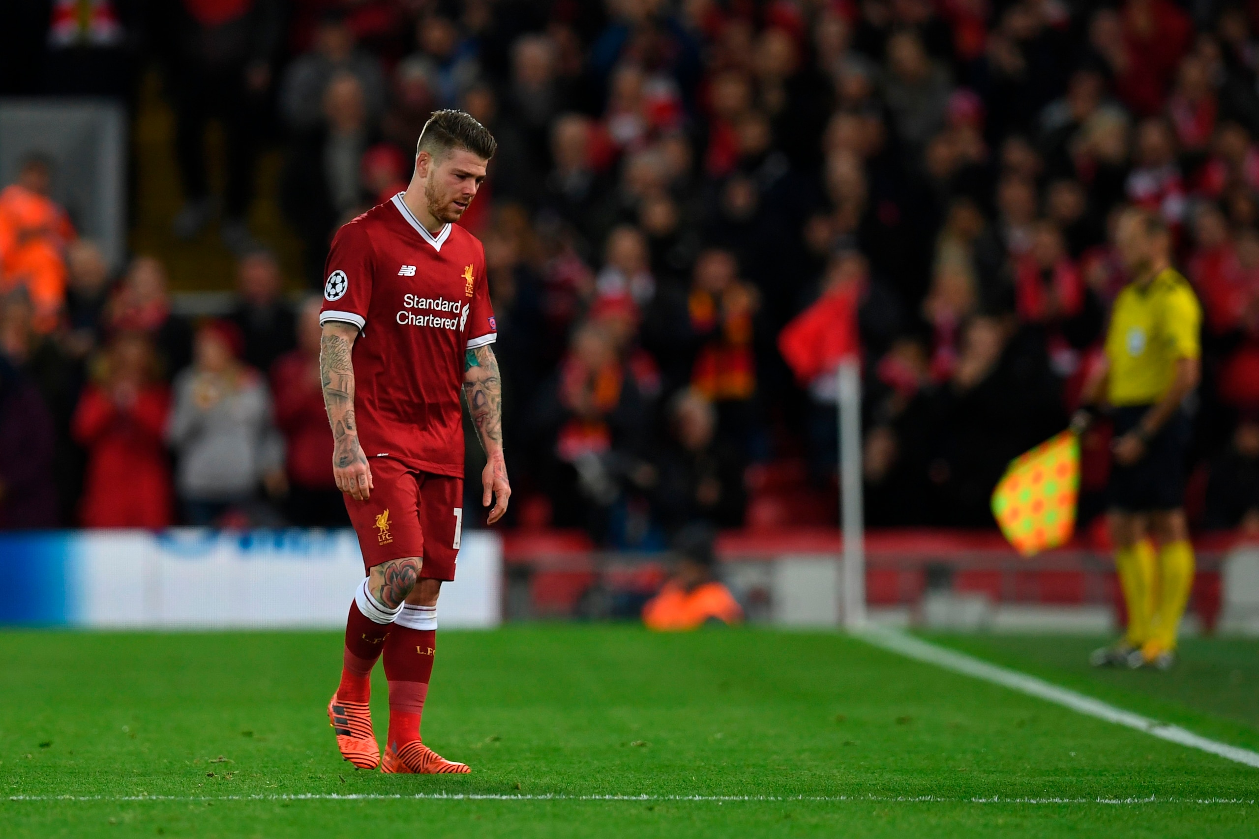 Liverpool's Spanish defender Alberto Moreno leaves the field with an injury during the UEFA Champions League Group E football match between Liverpool and Spartak Moscow at Anfield in Liverpool, north-west England on December 6, 2017. / AFP PHOTO / Paul EL