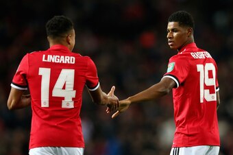 MANCHESTER, ENGLAND - SEPTEMBER 20: Marcus Rashford of Manchester United celebrates scoring his sides first goal with Jesse Lingard of Manchester United during the Carabao Cup Third Round match between Manchester United and Burton Albion at Old Trafford o