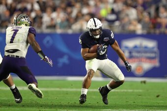GLENDALE, AZ - DECEMBER 30:  Running back Saquon Barkley #26 of the Penn State Nittany Lions rushes the football against the Washington Huskies during the second half of the Playstation Fiesta Bowl at University of Phoenix Stadium on December 30, 2017 in 