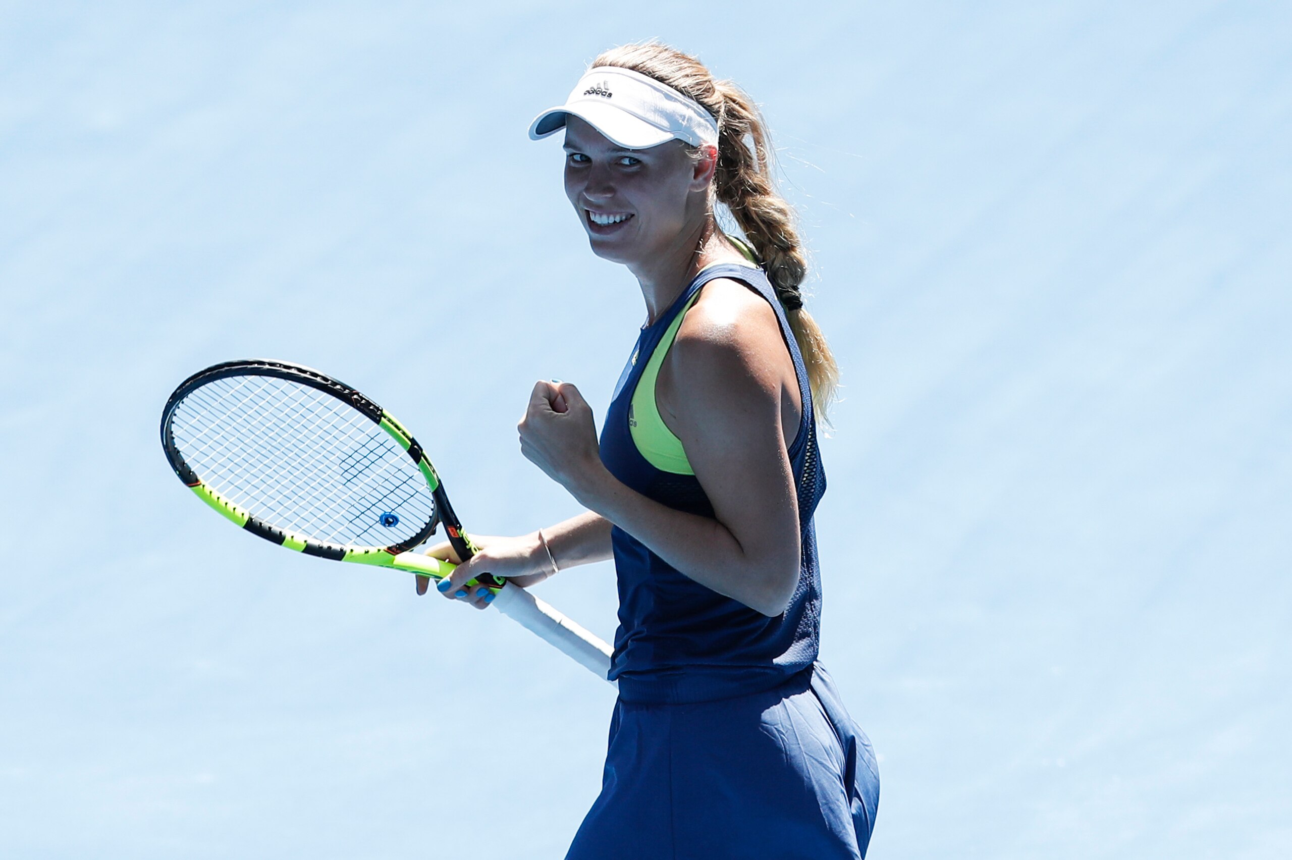 MELBOURNE, AUSTRALIA - JANUARY 25:  Caroline Wozniacki of Denmark celebrates winning match point in her semi-final match against Elise Mertens of Belgium on day 11 of the 2018 Australian Open at Melbourne Park on January 25, 2018 in Melbourne, Australia. 