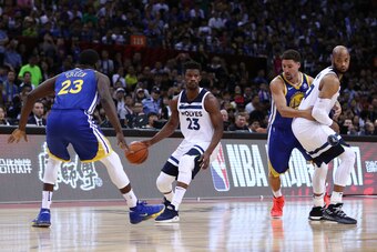 SHENZHEN, CHINA - OCTOBER 05: Jimmy Butler #23 and Taj Gibson #67 of the Minnesota Timberwolves in action against Klay Thompson #11 and Draymond Green #23 of the Golden State Warriors during the game between the Minnesota Timberwolves and the Golden State