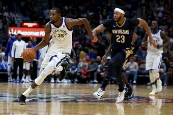 NEW ORLEANS, LA - OCTOBER 20:  Kevin Durant #35 of the Golden State Warriors drives past Anthony Davis #23 of the New Orleans Pelicans during a game at Smoothie King Center on October 20, 2017 in New Orleans, Louisiana.  NOTE TO USER: User expressly ackno