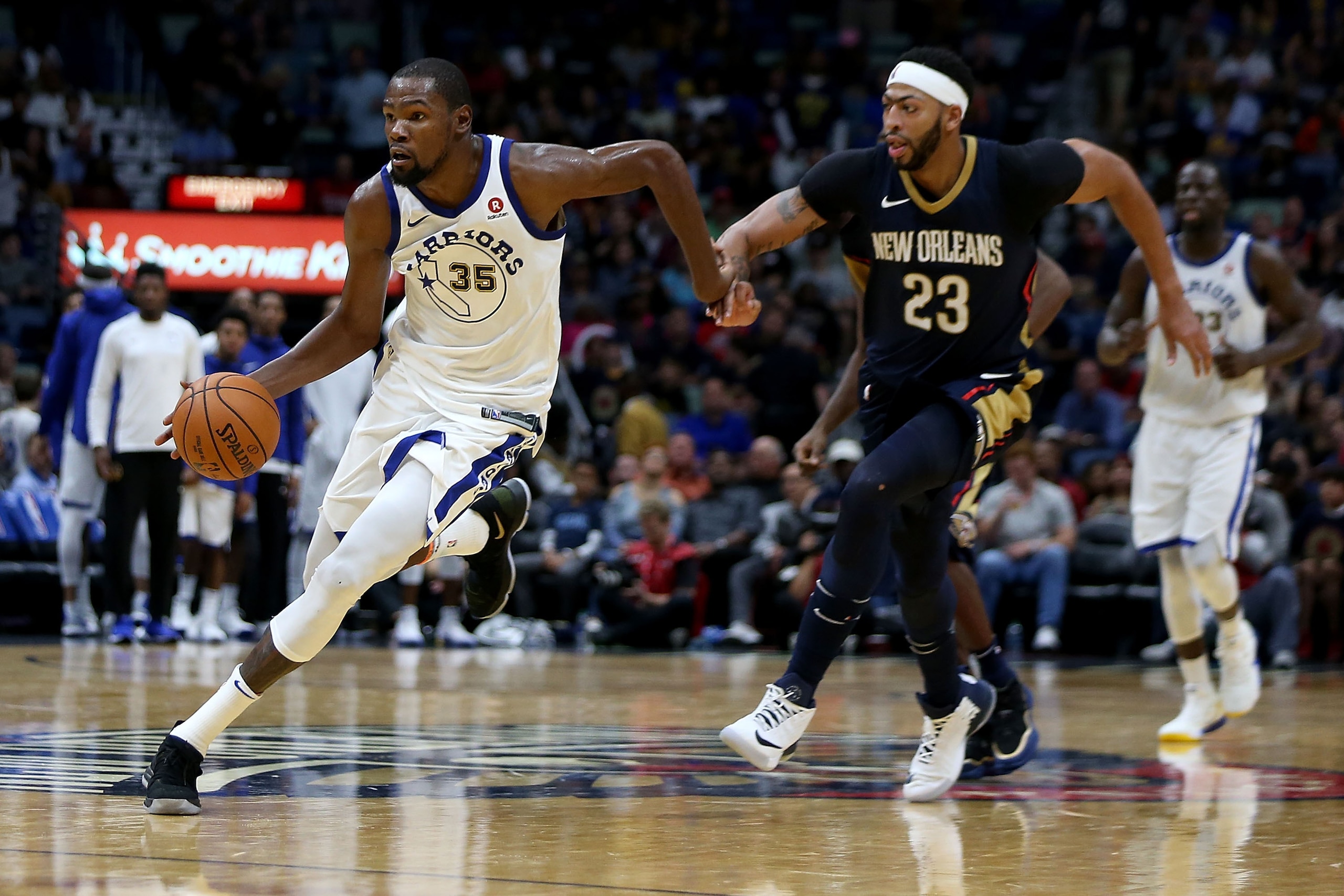 NEW ORLEANS, LA - OCTOBER 20:  Kevin Durant #35 of the Golden State Warriors drives past Anthony Davis #23 of the New Orleans Pelicans during a game at Smoothie King Center on October 20, 2017 in New Orleans, Louisiana.  NOTE TO USER: User expressly ackno