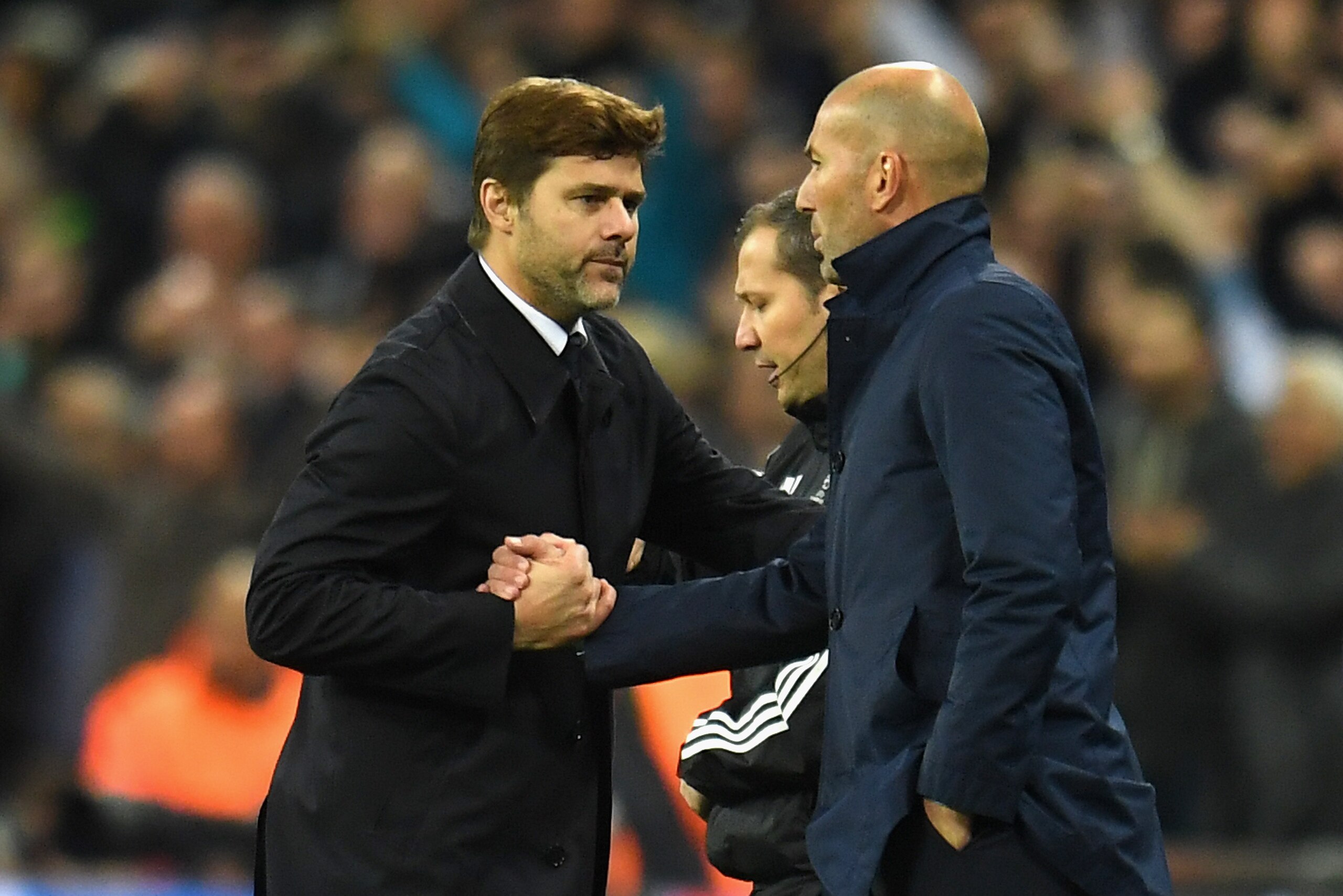 LONDON, ENGLAND - NOVEMBER 01:  Mauricio Pochettino, Manager of Tottenham Hotspur and Zinedine Zidane, Manager of Real Madrid shake hands following the game at the UEFA Champions League group H match between Tottenham Hotspur and Real Madrid at Wembley St