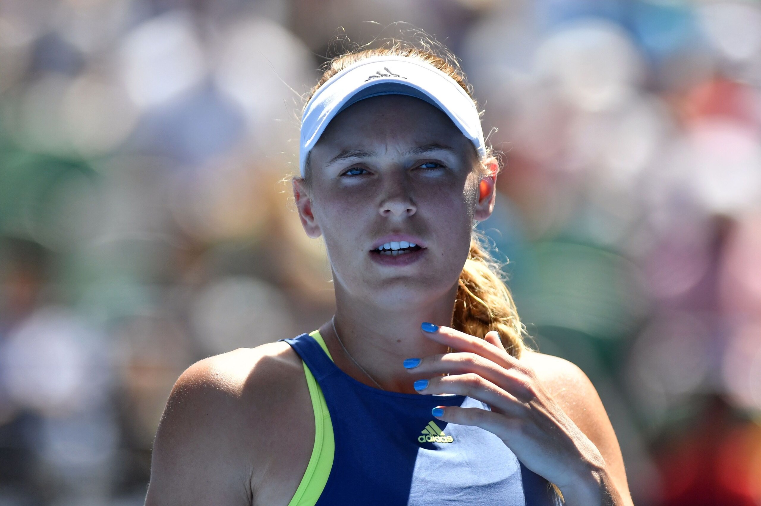 Denmark's Caroline Wozniacki reacts after a point against Belgium's Elise Mertens during their women's singles semi-finals match on day 11 of the Australian Open tennis tournament in Melbourne on January 25, 2018. / AFP PHOTO / SAEED KHAN / -- IMAGE RESTR