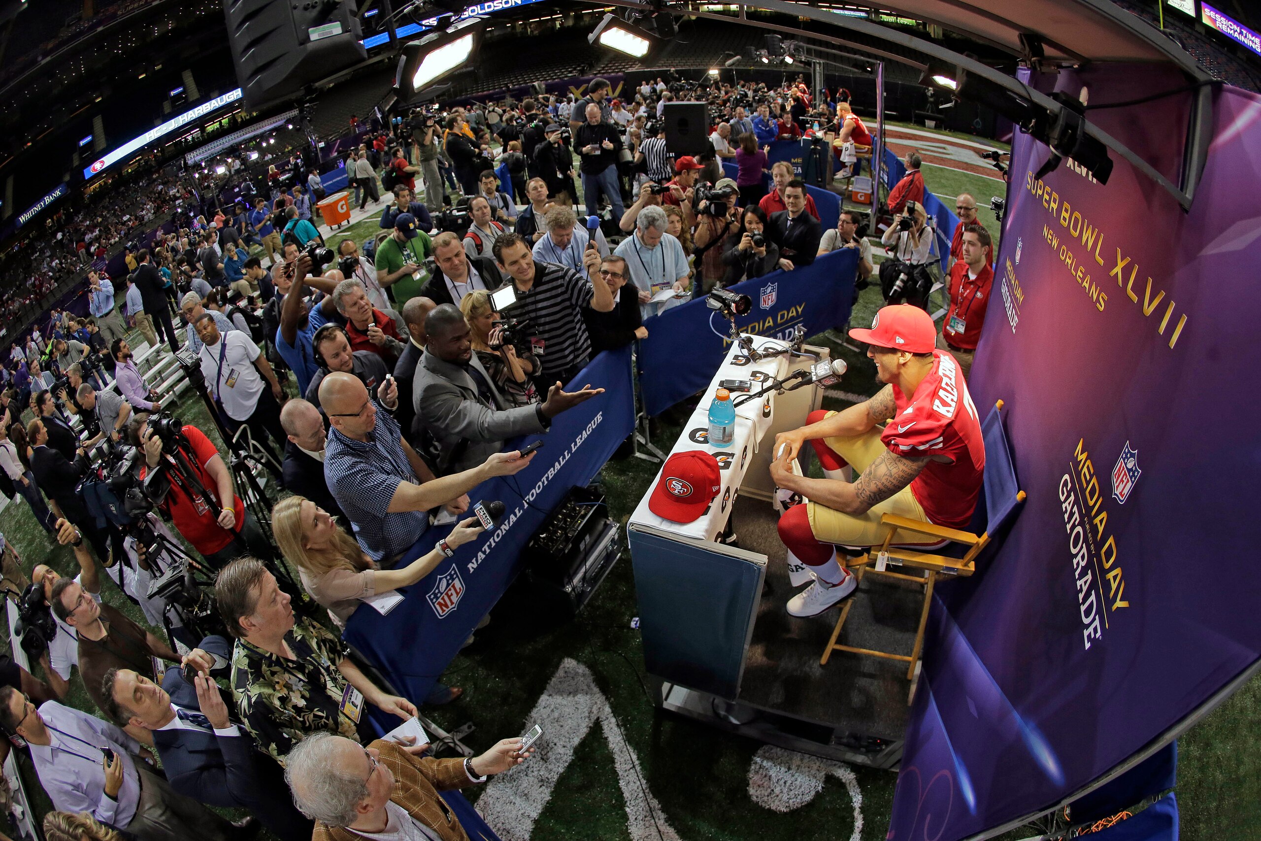Colin Kaepernick amid the Super Bowl media day chaos.