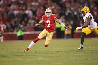 SAN FRANCISCO, CA - JANUARY 12: Colin Kaepernick #7 of the San Francisco 49ers rushes during the game against the Green Bay Packers at Candlestick Park on January 12, 2012 in San Francisco, California. The 49ers defeated the Packers 45-31. (Photo by Micha