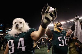 PHILADELPHIA, PA - JANUARY 21:  Beau Allen #94 and Chris Long #56 of the Philadelphia Eagles celebrates their teams win while wearing a dog masks over the Minnesota Vikings in the NFC Championship game at Lincoln Financial Field on January 21, 2018 in Phi