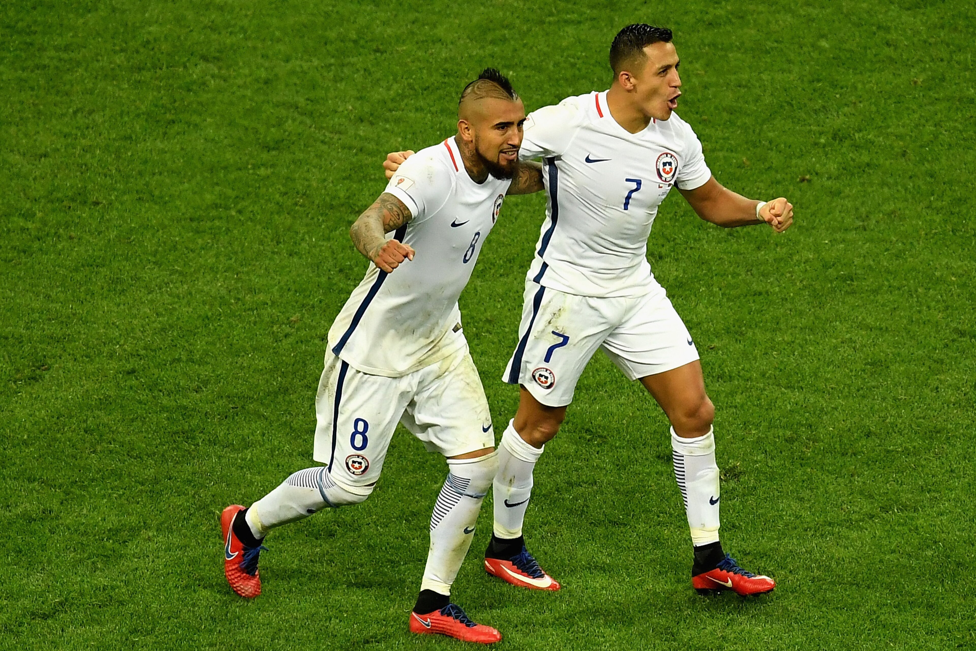 KAZAN, RUSSIA - JUNE 28:  Alexis Sanchez of Chile celebrates scoring his sides third goal with Arturo Vidal of Chile during the FIFA Confederations Cup Russia 2017 Semi-Final between Portugal and Chile at Kazan Arena on June 28, 2017 in Kazan, Russia.  (P