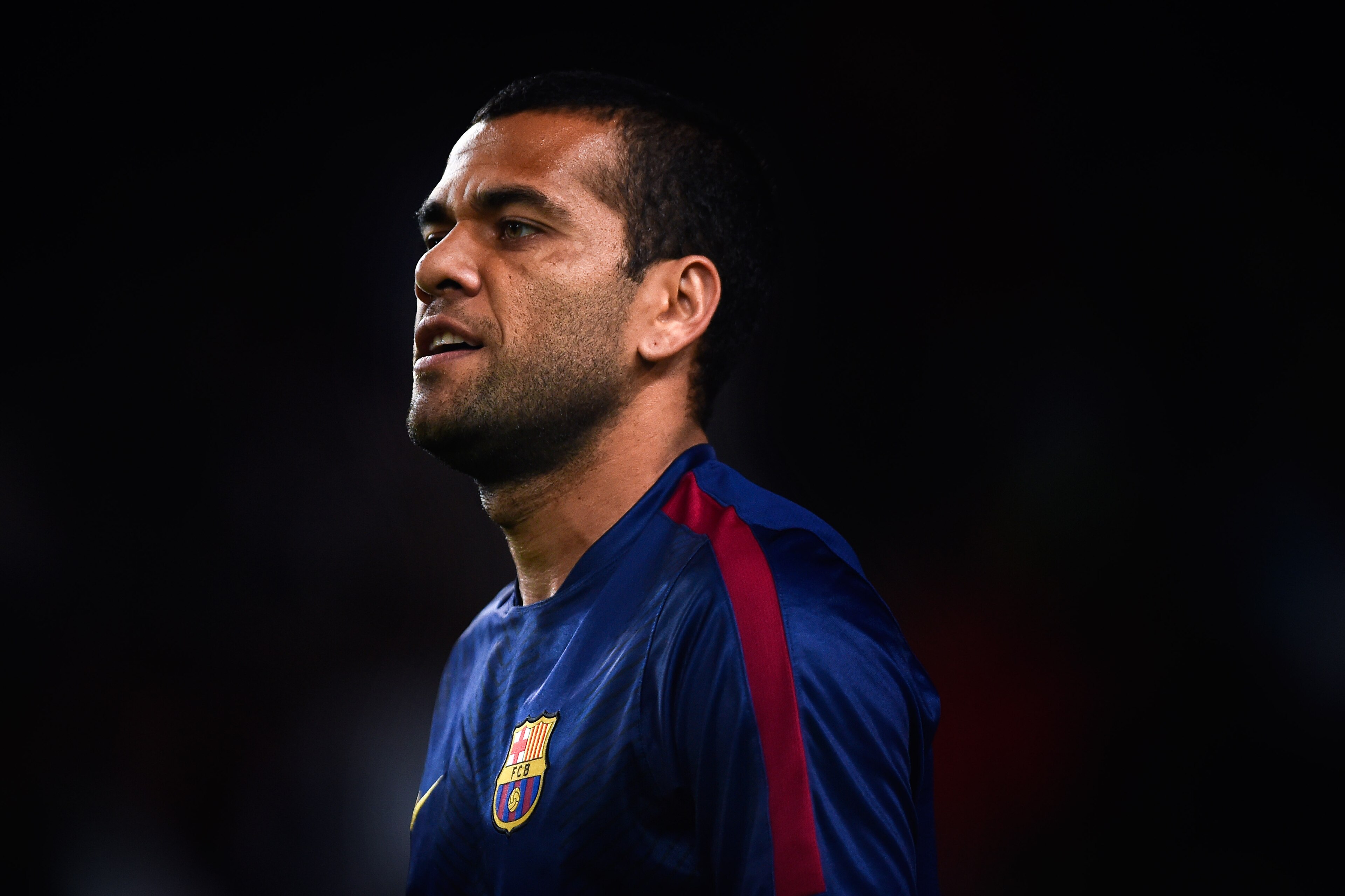 BARCELONA, SPAIN - NOVEMBER 22: Dani Alves of FC Barcelona looks on during the warm-up prior to the La Liga match between FC Barcelona and Sevilla FC at Camp Nou on November 22, 2014 in Barcelona, Spain. Lionel Messi beat the number of goal in the Span BARCELONA, SPAIN - NOVEMBER 22: Dani Alves of FC Barcelona looks on during the warm-up prior to the La Liga match between FC Barcelona and Sevilla FC at Camp Nou on November 22, 2014 in Barcelona, Spain. Lionel Messi beat the number of goal in the Span