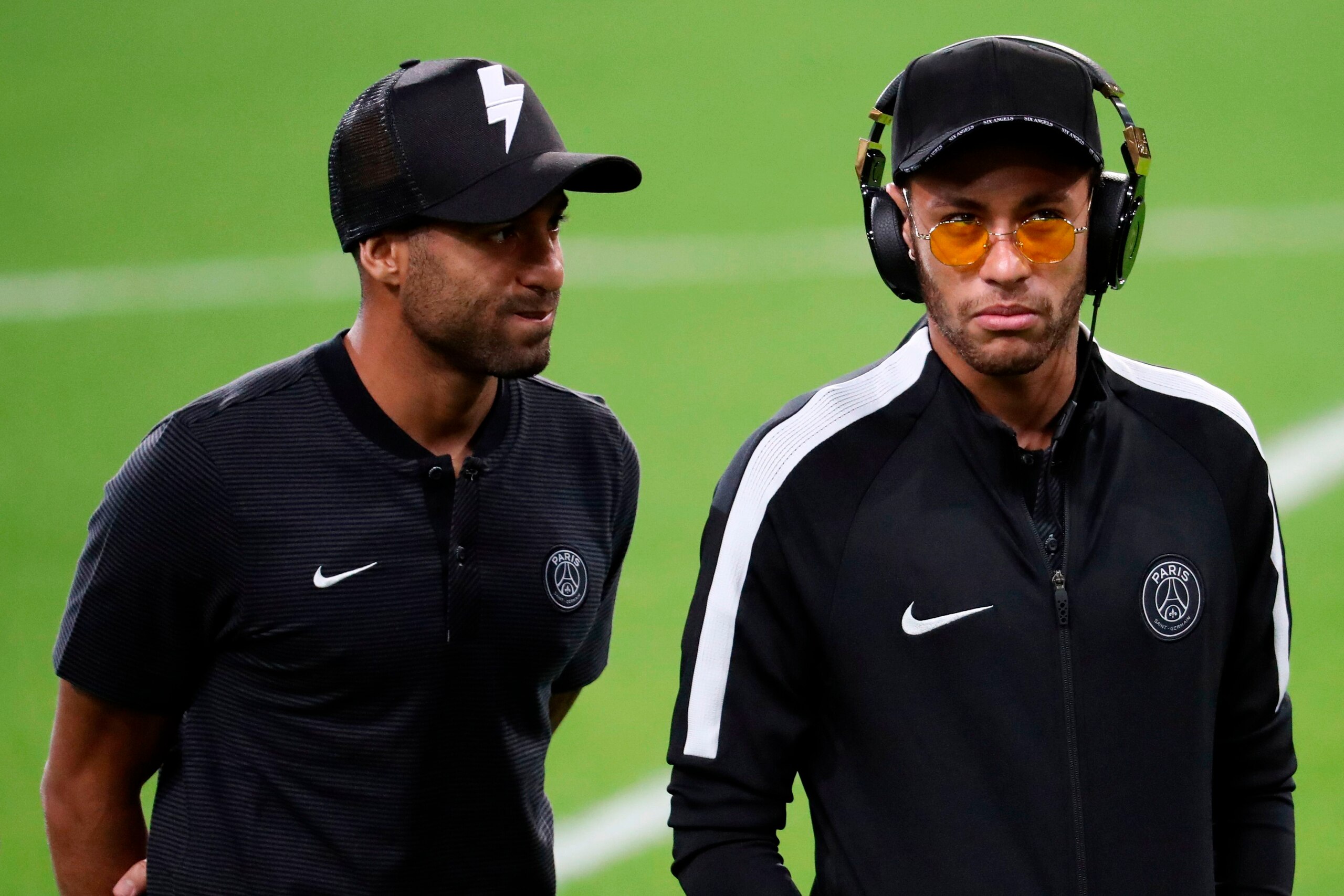 Paris Saint-Germain's Brazilian forward Neymar (R) and Paris Saint-Germain's Brazilian forward Lucas (L) attend a training session at the Constant Vanden Stock Stadium in Brussels, on October 17, 2017 on the eve of the UEFA Champions League Group B footba