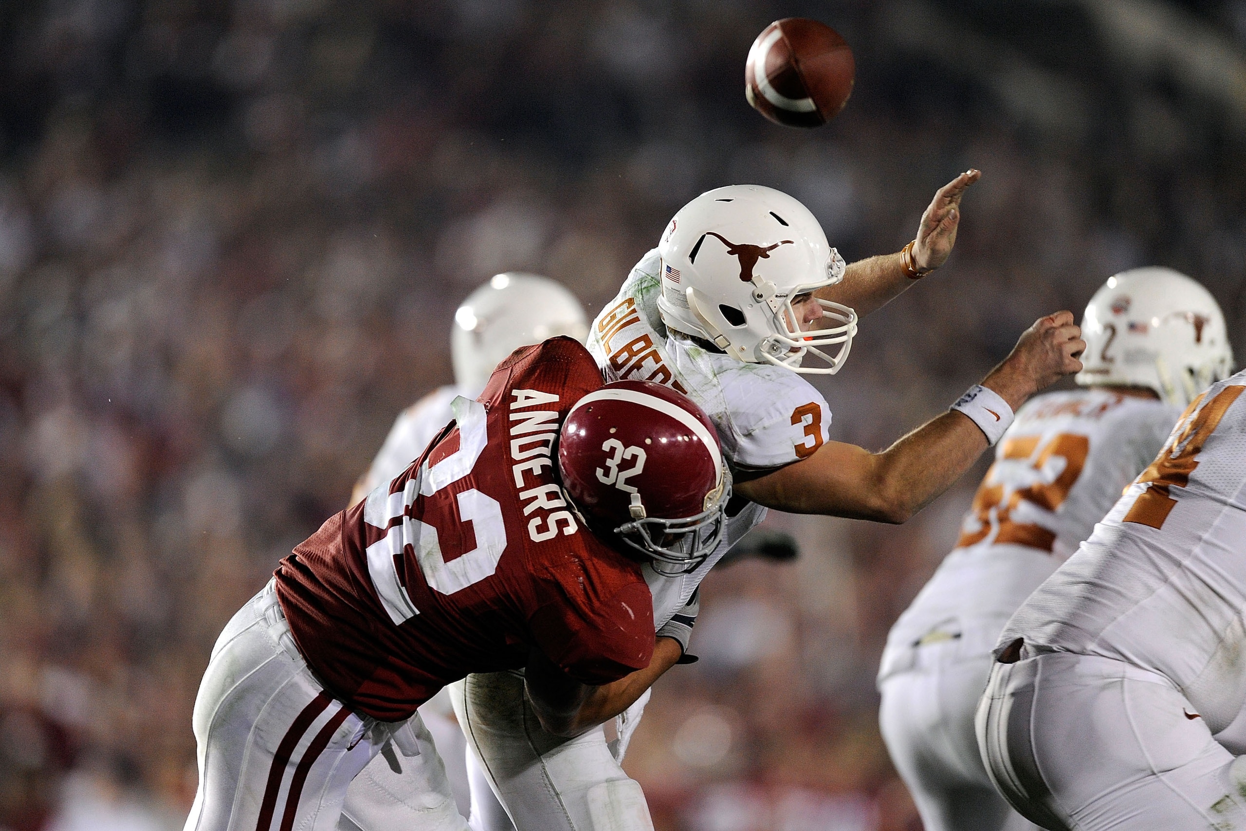 PASADENA, CA - JANUARY 07: Quarterback Garrett Gilbert #3 of the Texas Longhorns fumbles the ball as he is hit by linebacker Eryk Anders #32 of the Alabama Crimson Tide during the Citi BCS National Championship game at the Rose Bowl on January 7, 2010 in PASADENA, CA - JANUARY 07: Quarterback Garrett Gilbert #3 of the Texas Longhorns fumbles the ball as he is hit by linebacker Eryk Anders #32 of the Alabama Crimson Tide during the Citi BCS National Championship game at the Rose Bowl on January 7, 2010 in