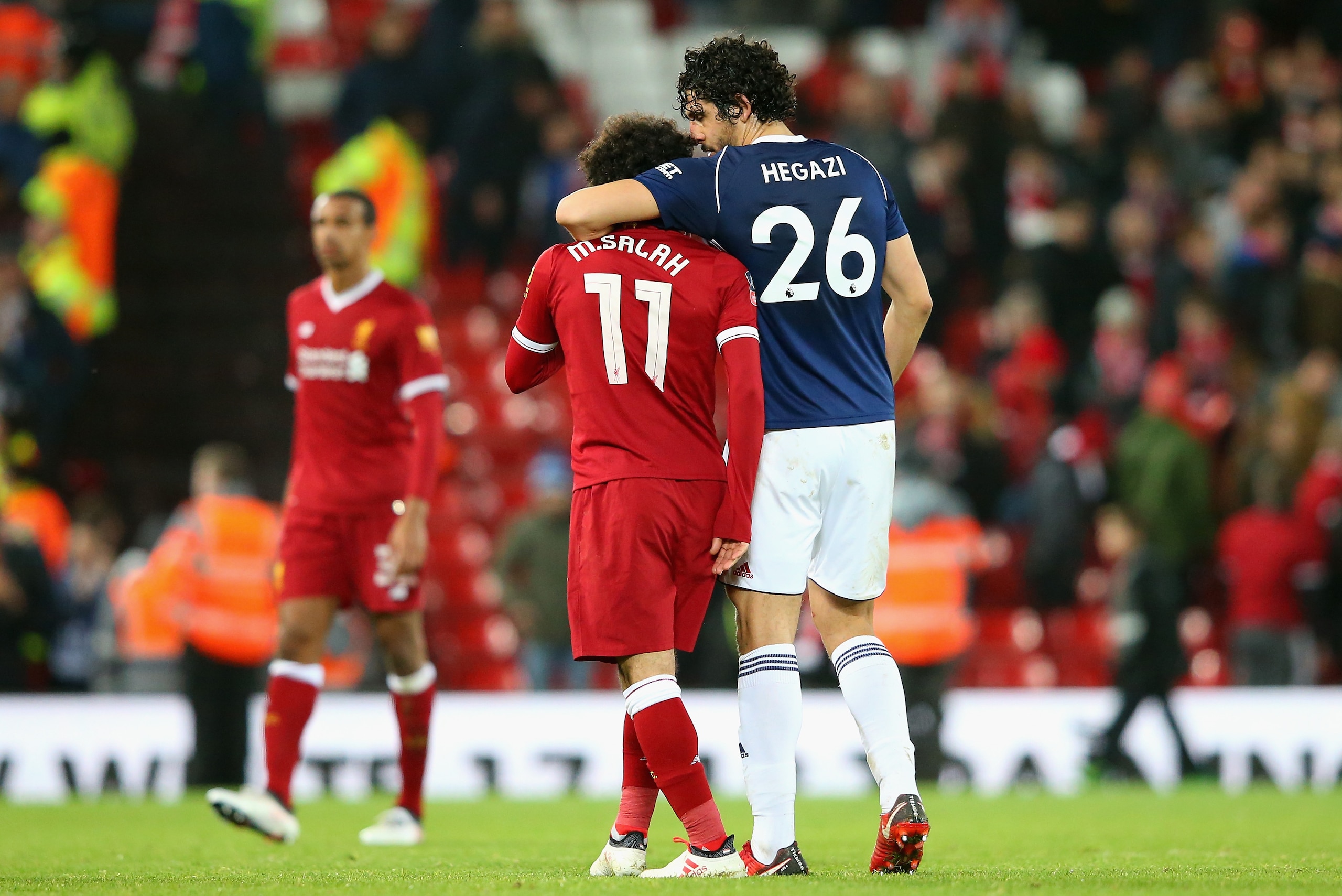 LIVERPOOL, ENGLAND - JANUARY 27: Mohamed Salah of Liverpool and Ahmed El-Sayed Hegazi of West Bromwich Albion speak during The Emirates FA Cup Fourth Round match between Liverpool and West Bromwich Albion at Anfield on January 27, 2018 in Liverpool, Engla