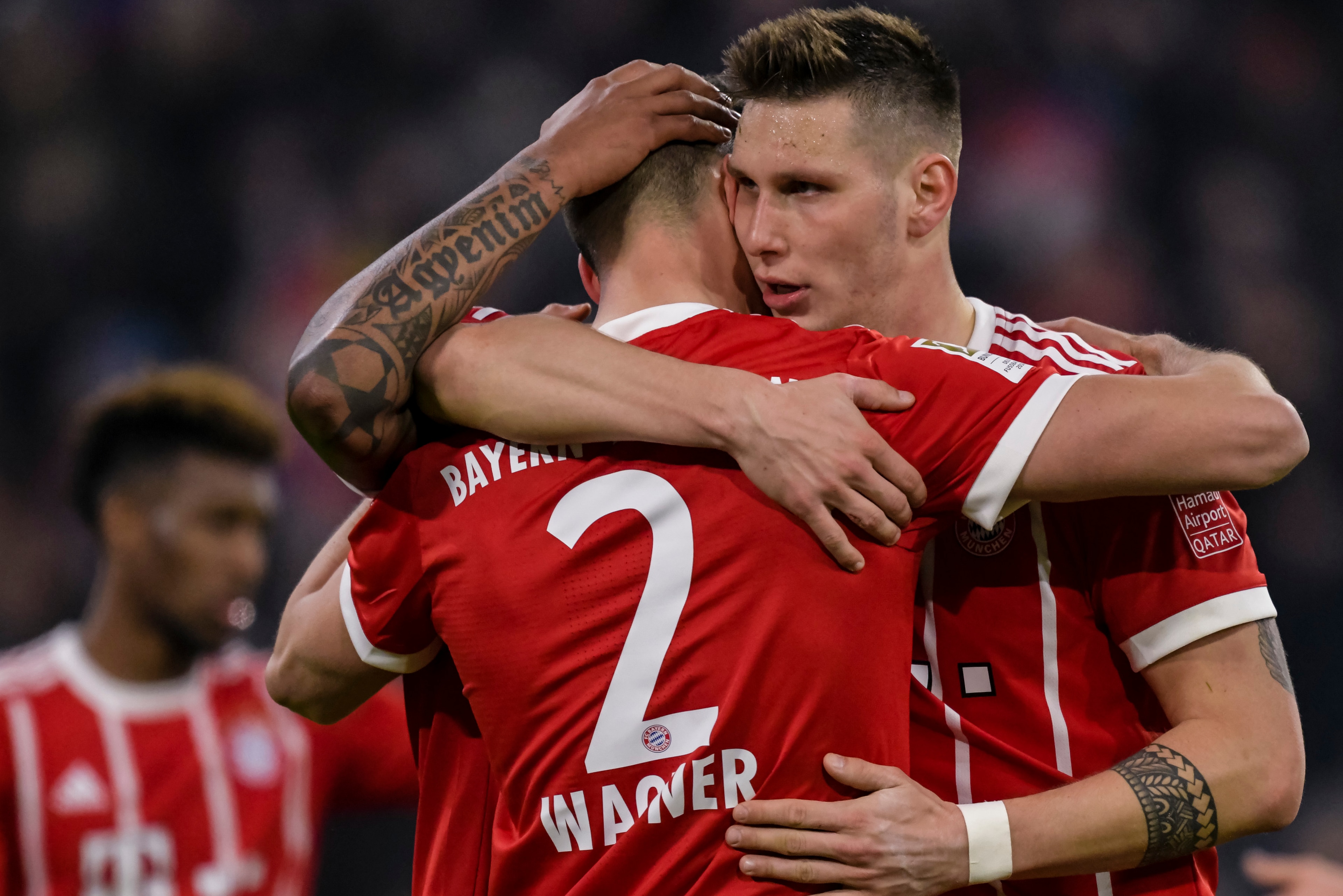 Bayern Munich's German forward Sandro Wagner (L) celebrates with teammate after scoring a goal during the German first division Bundesliga football match, Bayern Munich v TSG 1899 Hoffenheim, on January 27, 2018 in Munich, southern Germany. / AFP PHOTO / 