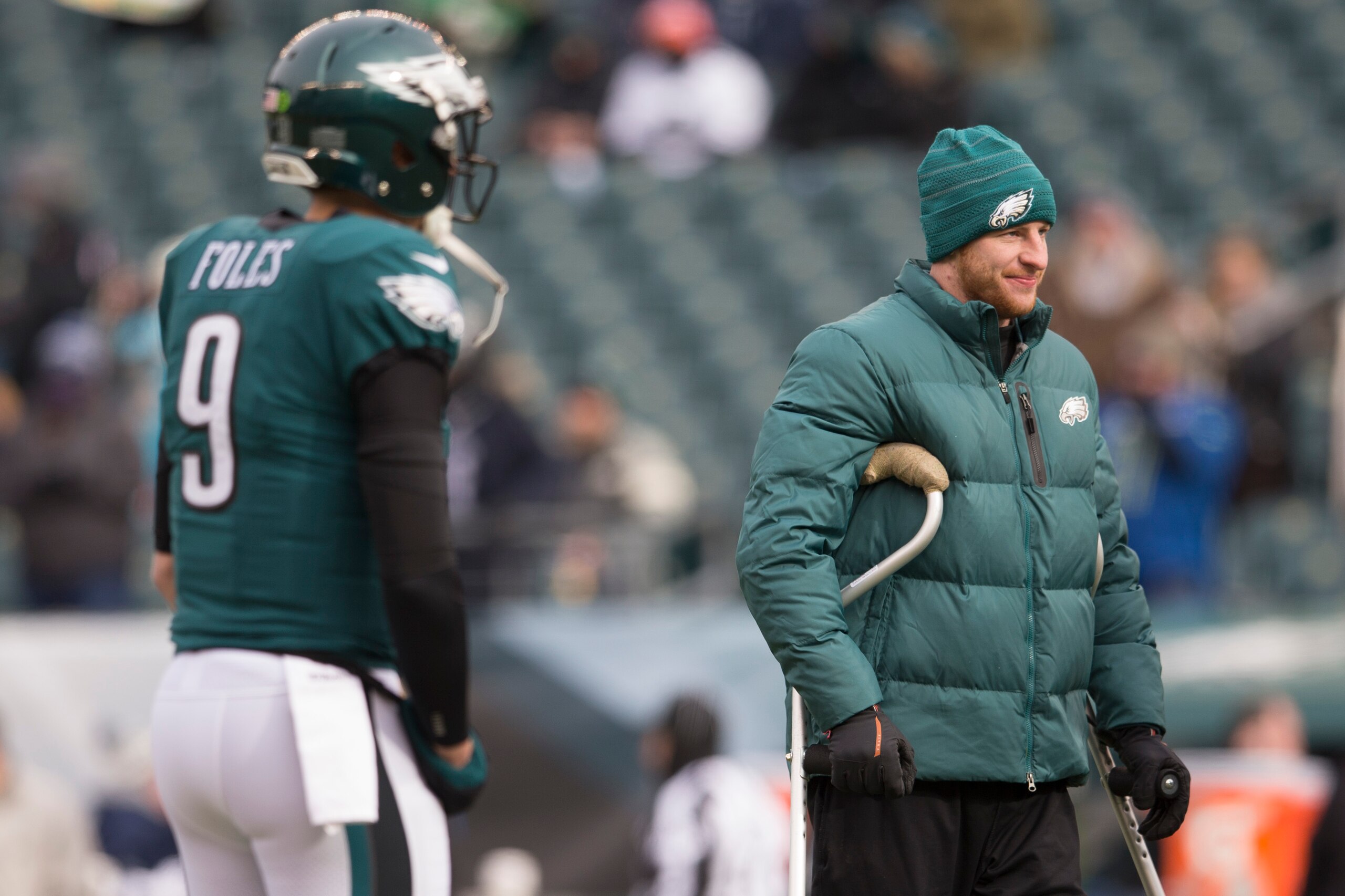 PHILADELPHIA, PA - DECEMBER 31: Quarterback Nick Foles #9 (R) of the Philadelphia Eagles warms up as injured quarterback Carson Wentz #11 (L) looks on before the game against the Dallas Cowboys at Lincoln Financial Field on December 31, 2017 in Philadelph PHILADELPHIA, PA - DECEMBER 31: Quarterback Nick Foles #9 (R) of the Philadelphia Eagles warms up as injured quarterback Carson Wentz #11 (L) looks on before the game against the Dallas Cowboys at Lincoln Financial Field on December 31, 2017 in Philadelph