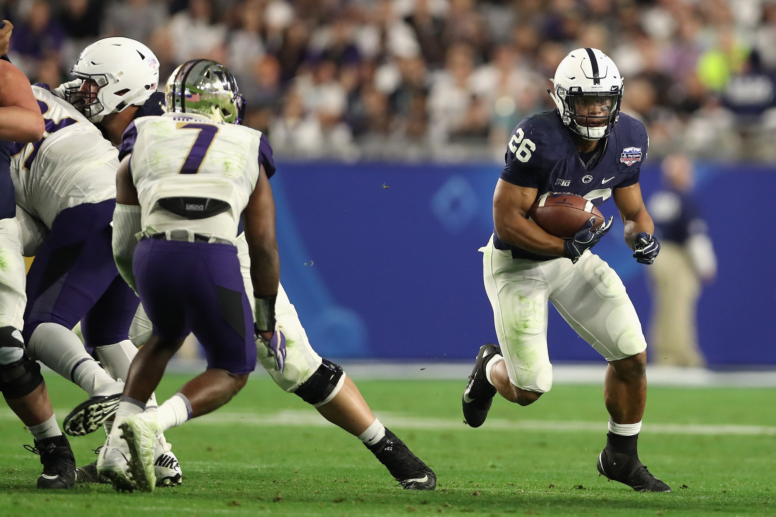 GLENDALE, AZ - DECEMBER 30:  Running back Saquon Barkley #26 of the Penn State Nittany Lions rushes the football against the Washington Huskies during the second half of the Playstation Fiesta Bowl at University of Phoenix Stadium on December 30, 2017 in 