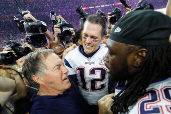 HOUSTON, TX - FEBRUARY 05:  Head coach Bill Belichick, Tom Brady #12 and LeGarrette Blount #29 of the New England Patriots celebrate after defeating the Atlanta Falcons during Super Bowl 51 at NRG Stadium on February 5, 2017 in Houston, Texas. The Patriot