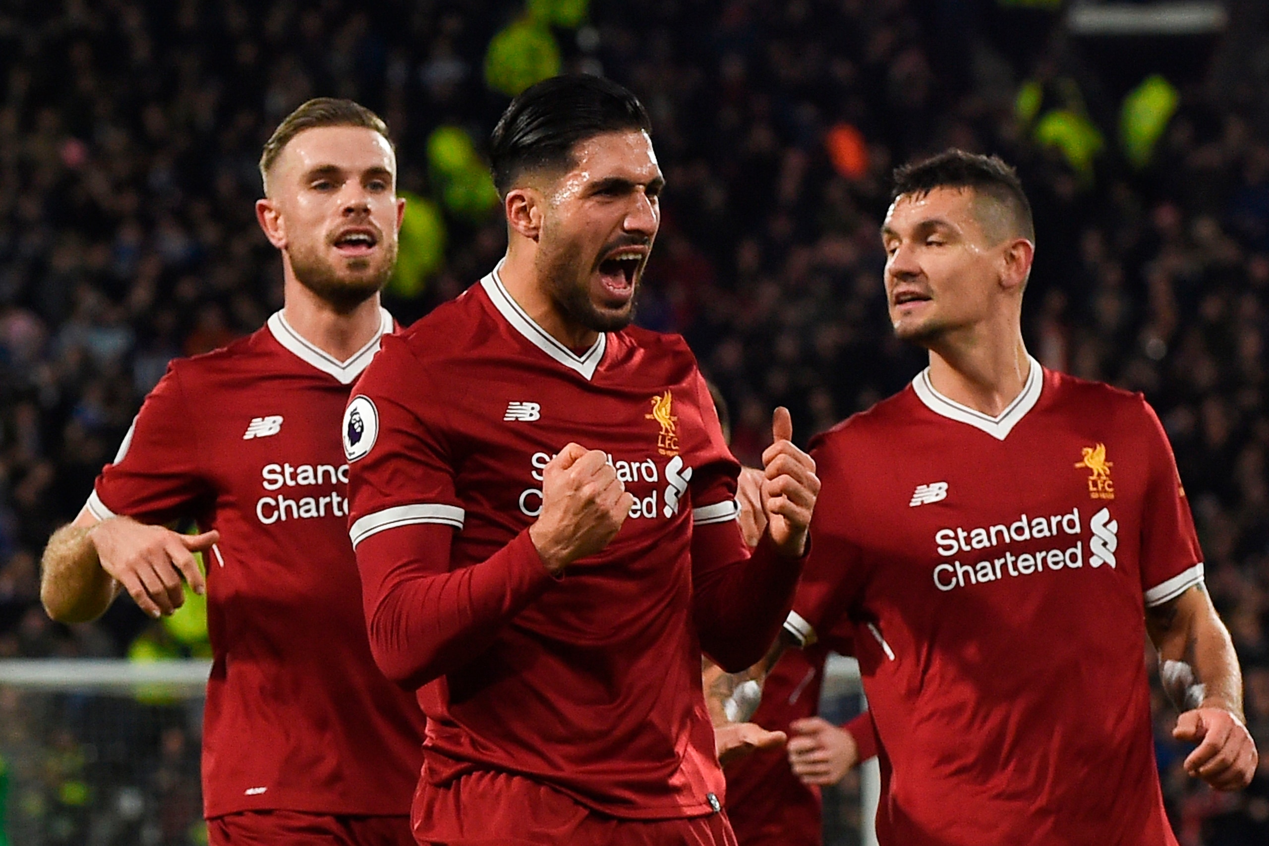 Liverpool's German midfielder Emre Can (C) celebrates scoring the opening goal during the English Premier League football match between Huddersfield Town and Liverpool at the John Smith's stadium in Huddersfield, northern England on January 30, 2018. / AF