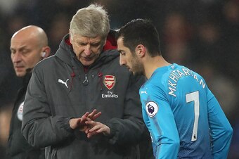 SWANSEA, WALES - JANUARY 30:  Arsenal Head Coach / Manager Arsene Wenger gives instructions to Henrikh Mkhitaryan of Arsenal as he prepares to come on as a substitute during the Premier League match between Swansea City and Arsenal at Liberty Stadium on J