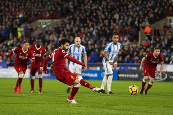 HUDDERSFIELD, ENGLAND - JANUARY 30: Mohamed Salah of Liverpool scores a goal to make it 0-3 during the Premier League match between Huddersfield Town and Liverpool at John Smith's Stadium on January 30, 2018 in Huddersfield, England. (Photo by Robbie Jay 