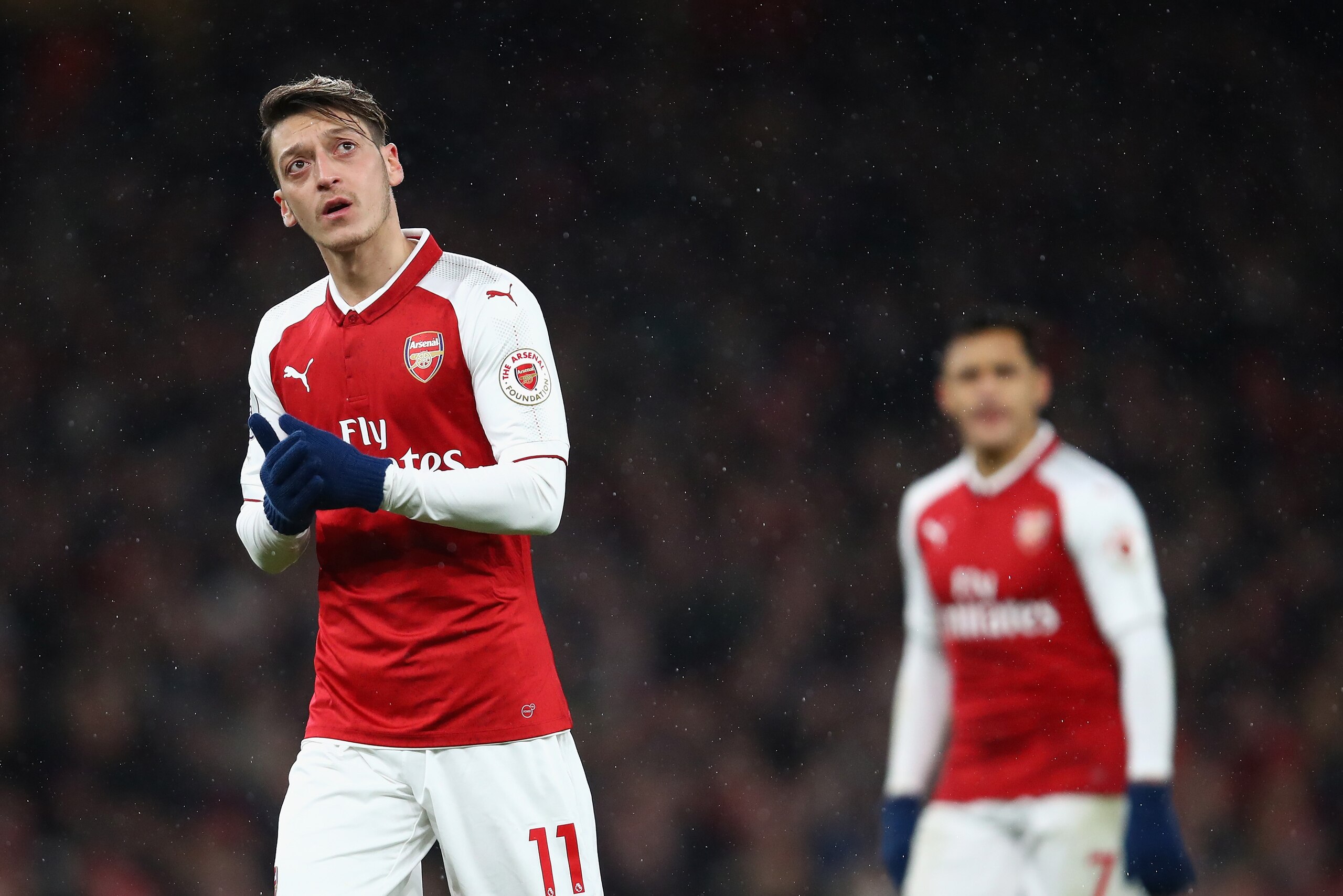 LONDON, ENGLAND - DECEMBER 16:  Mesut Ozil and Alexis Sanchez of Arsenal look on during the Premier League match between Arsenal and Newcastle United at Emirates Stadium on December 16, 2017 in London, England.  (Photo by Julian Finney/Getty Images)