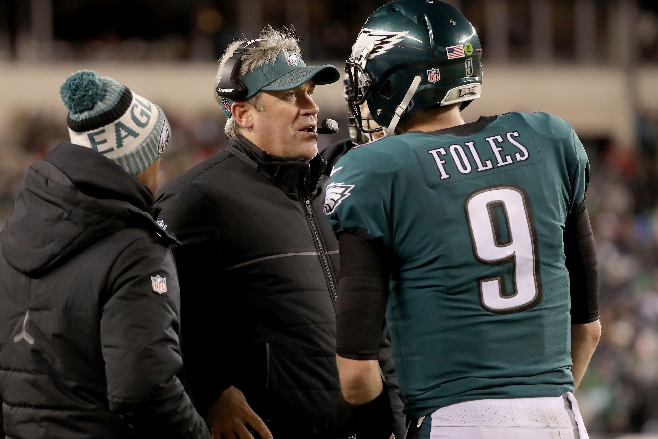 PHILADELPHIA, PA - JANUARY 13:  Head coach Doug Pederson of the Philadelphia Eagles talks Nick Foles #9 on the sidelines against the Atlanta Falcons during the fourth quarter in the NFC Divisional Playoff game at Lincoln Financial Field on January 13, 201