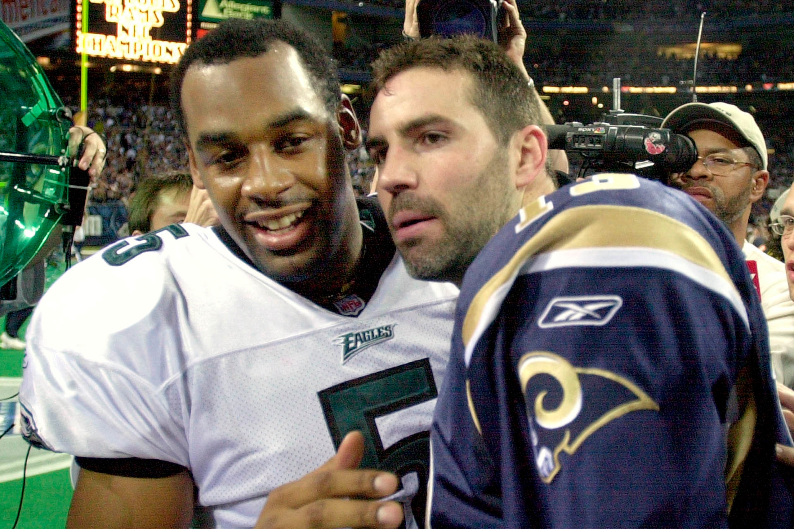 Donovan McNabb and Rams QB Kurt Warner.